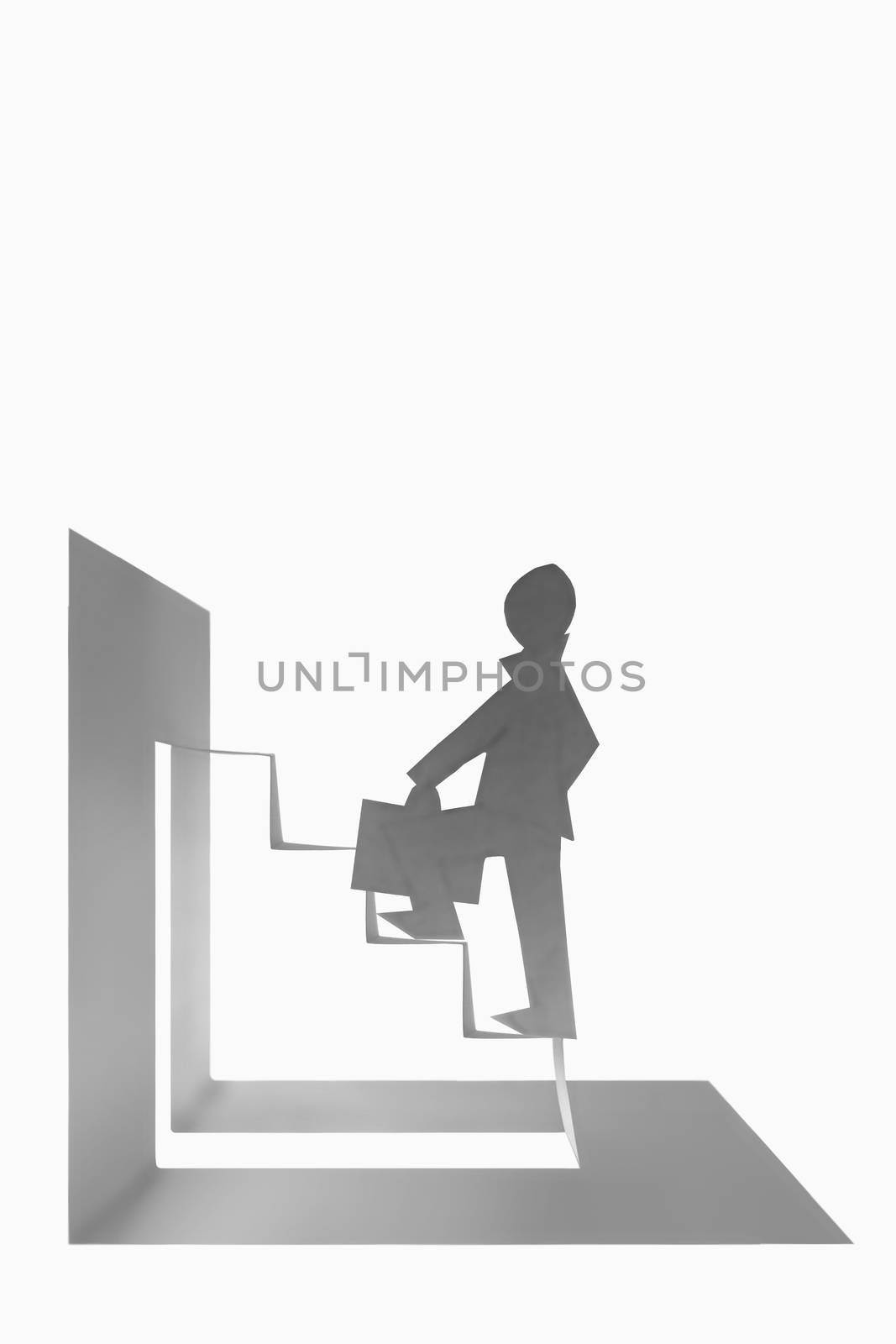 Businessman stepping up a staircase