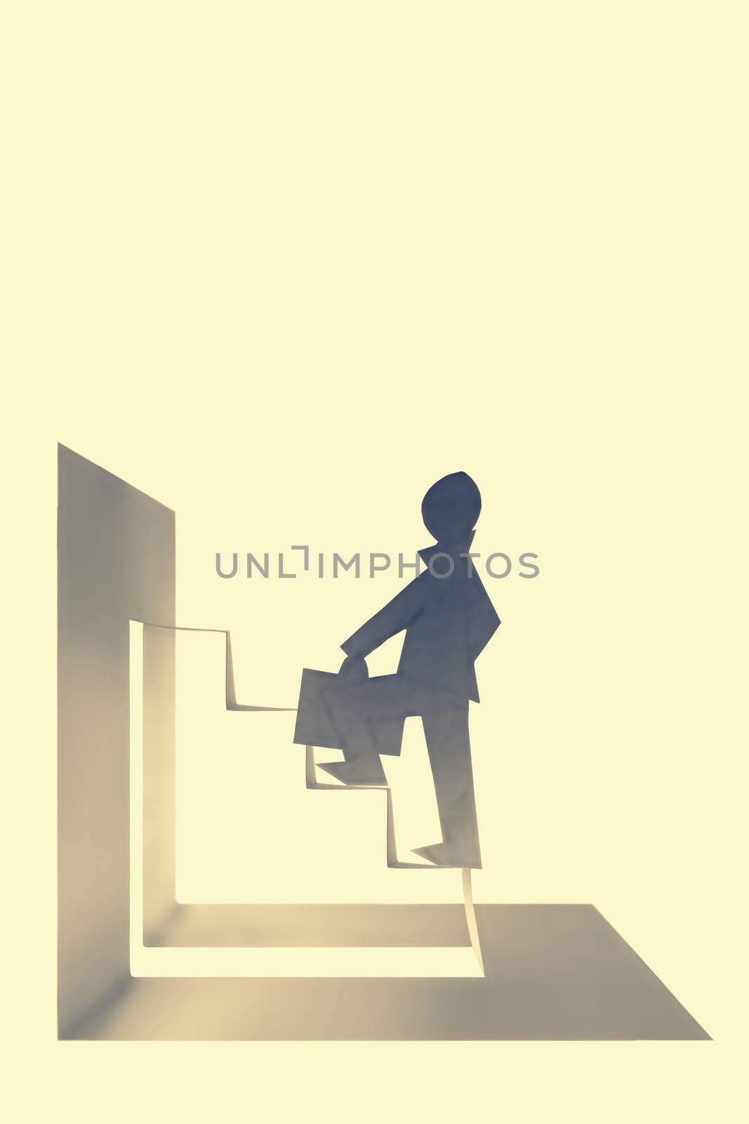 Businessman stepping up a staircase