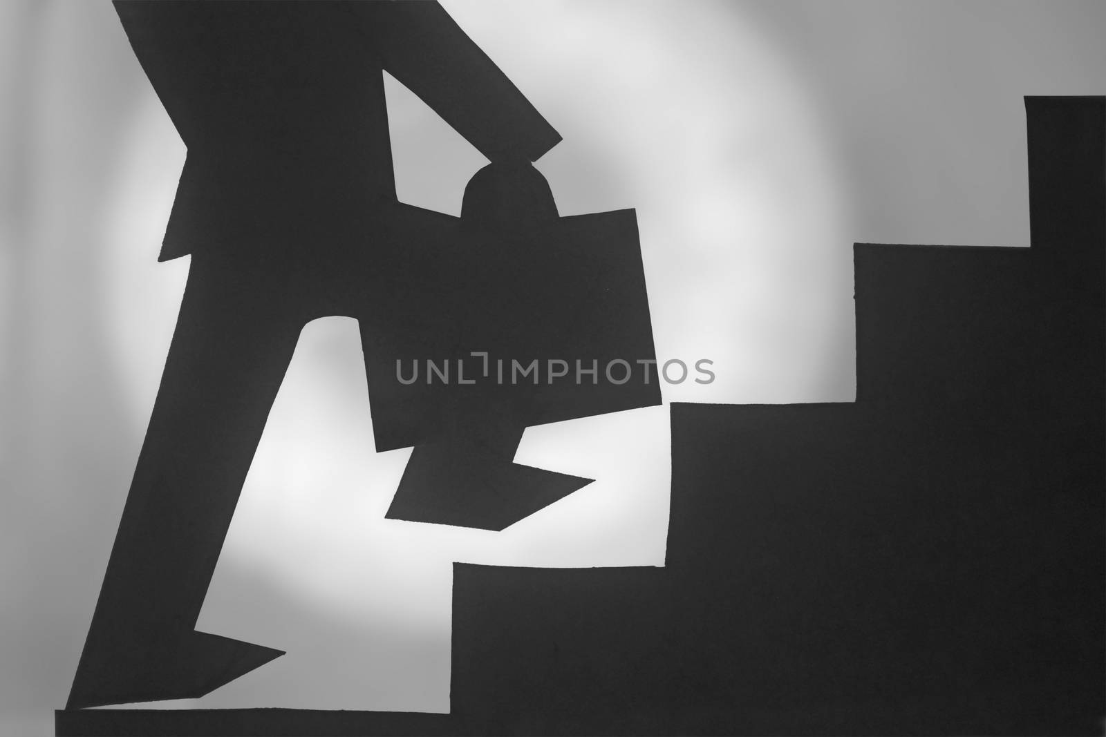 Businessman stepping up a staircase