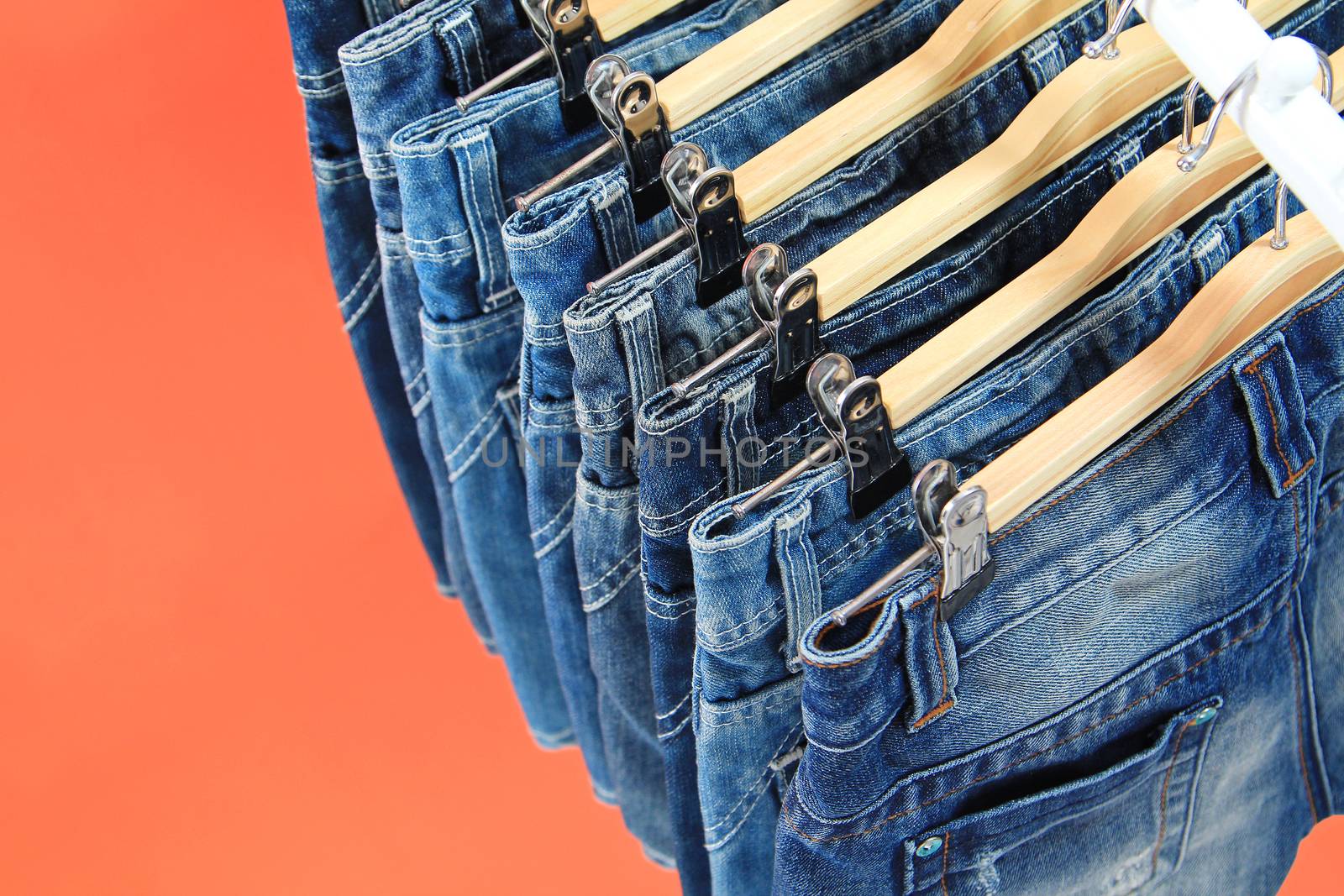 Row of hanged blue jeans