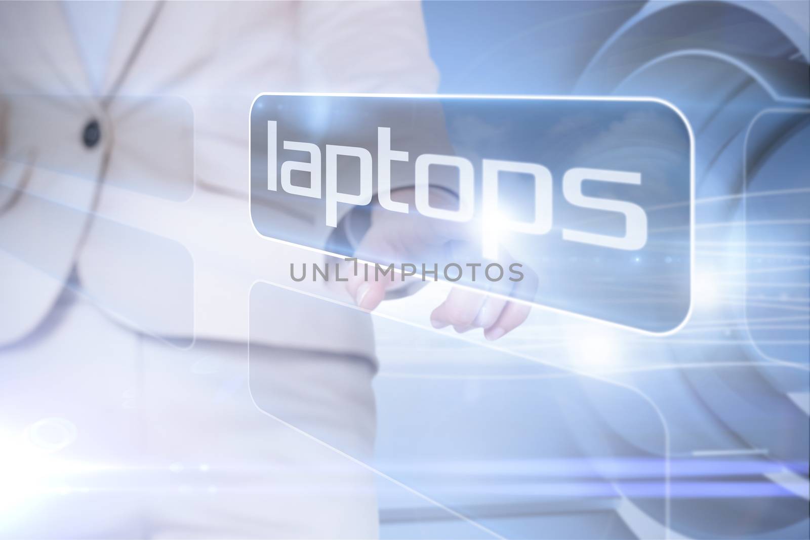 Businesswoman pointing to word laptops by Wavebreakmedia