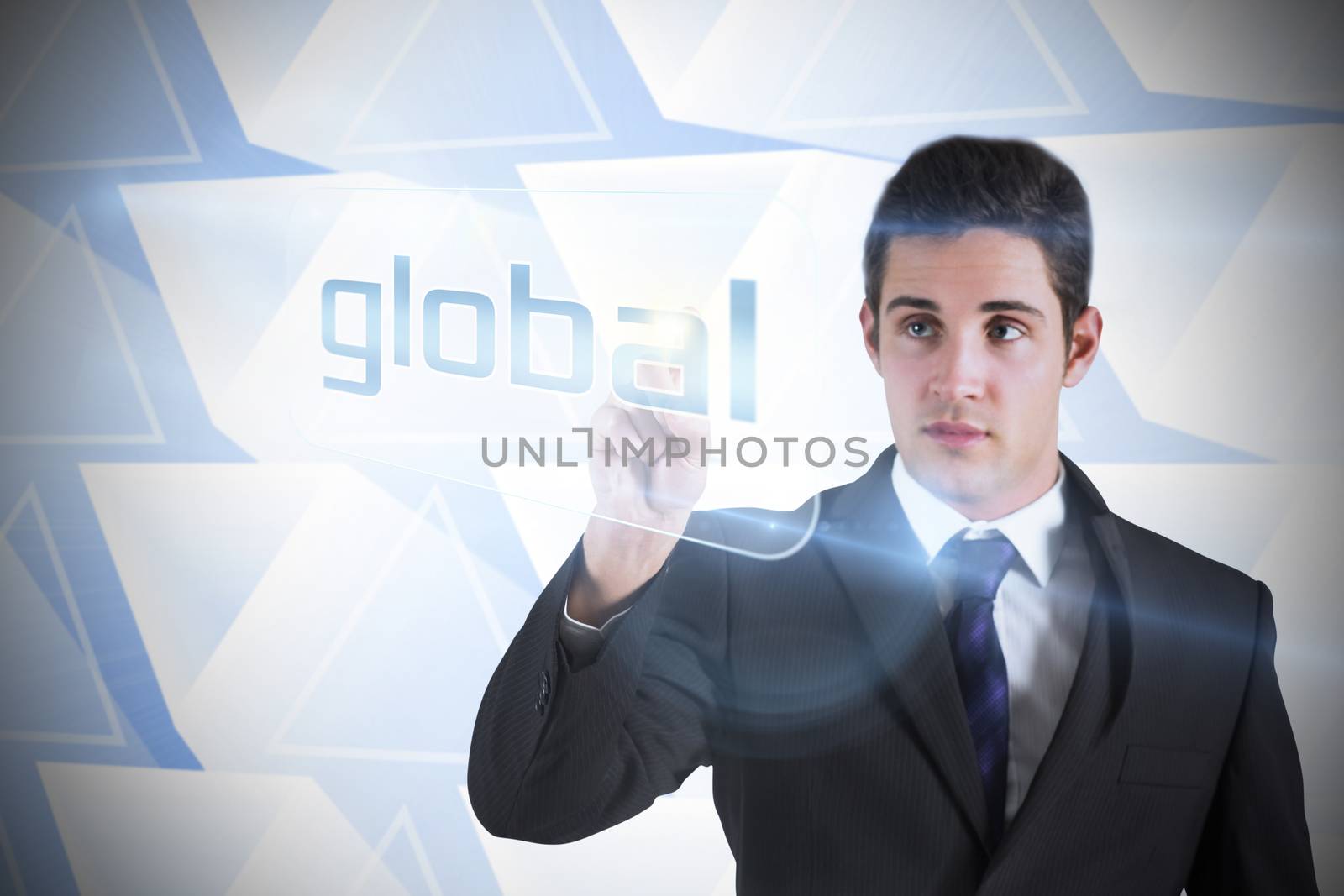 Businessman pointing to word global against abstract glowing triangles