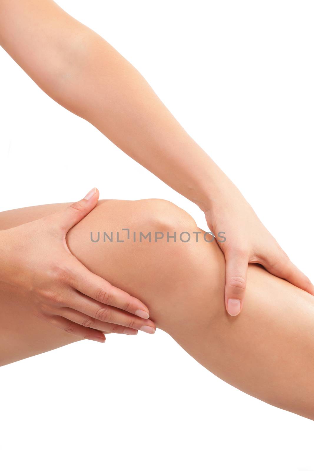 Knee injury. Woman holding her knee isolated on white background. 