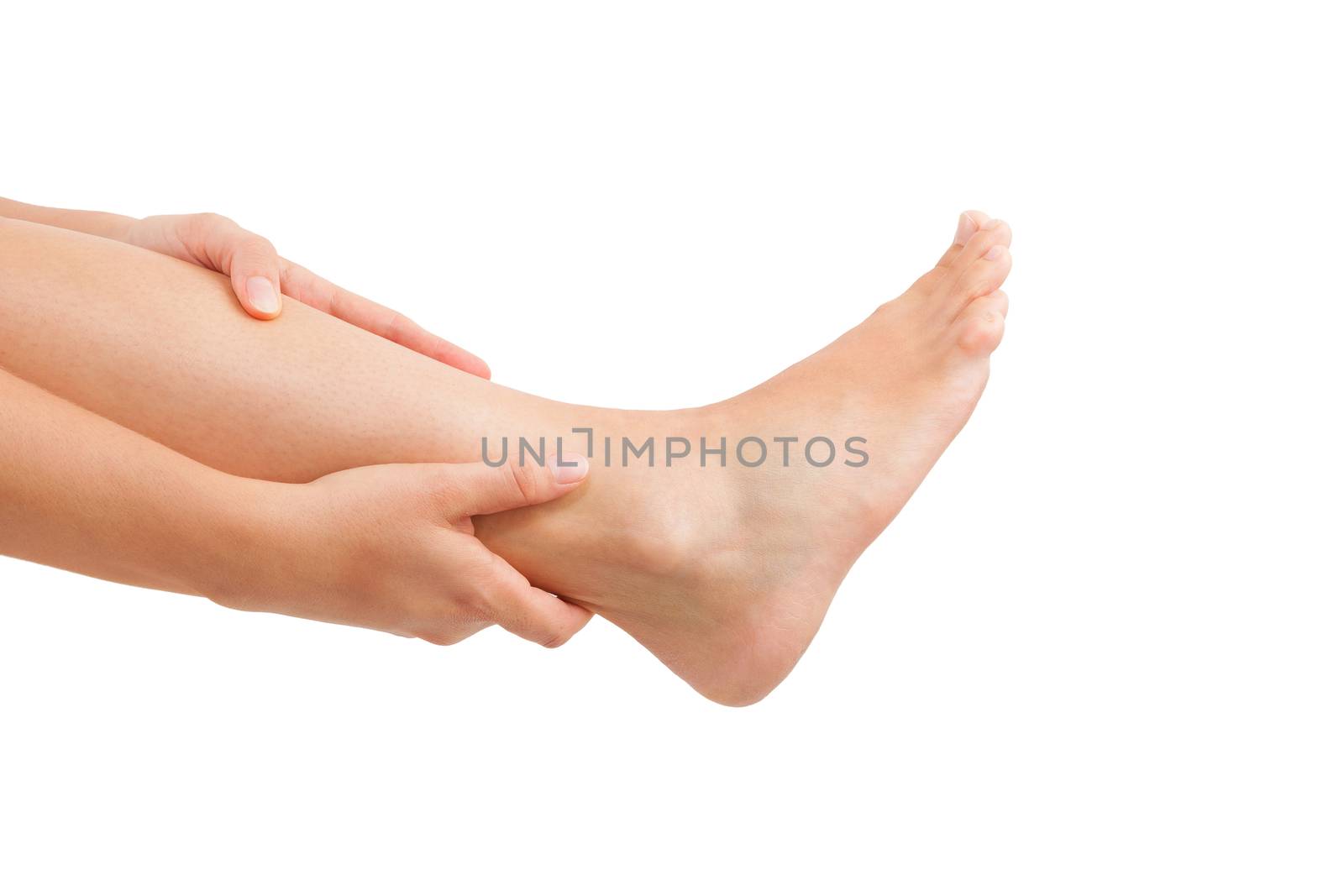 Muscle injuries and muscle strain. Female hand holding leg isolated on white background.