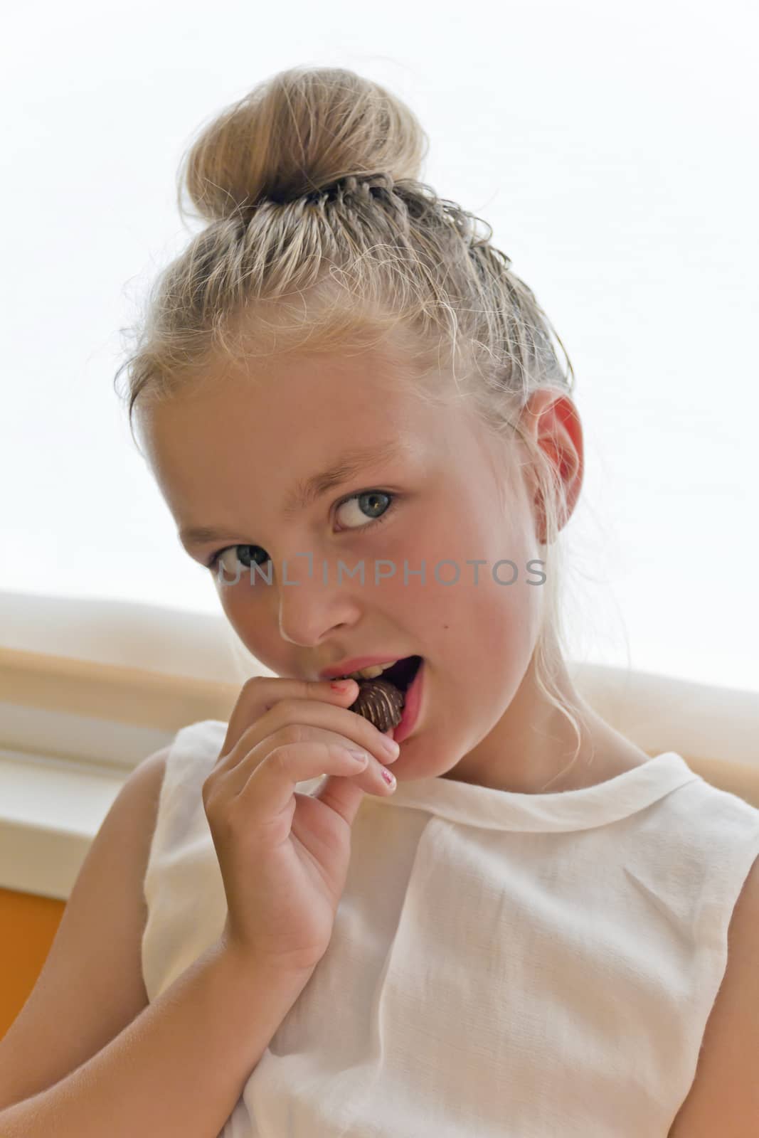 Photo of eating cute girl with blond hair