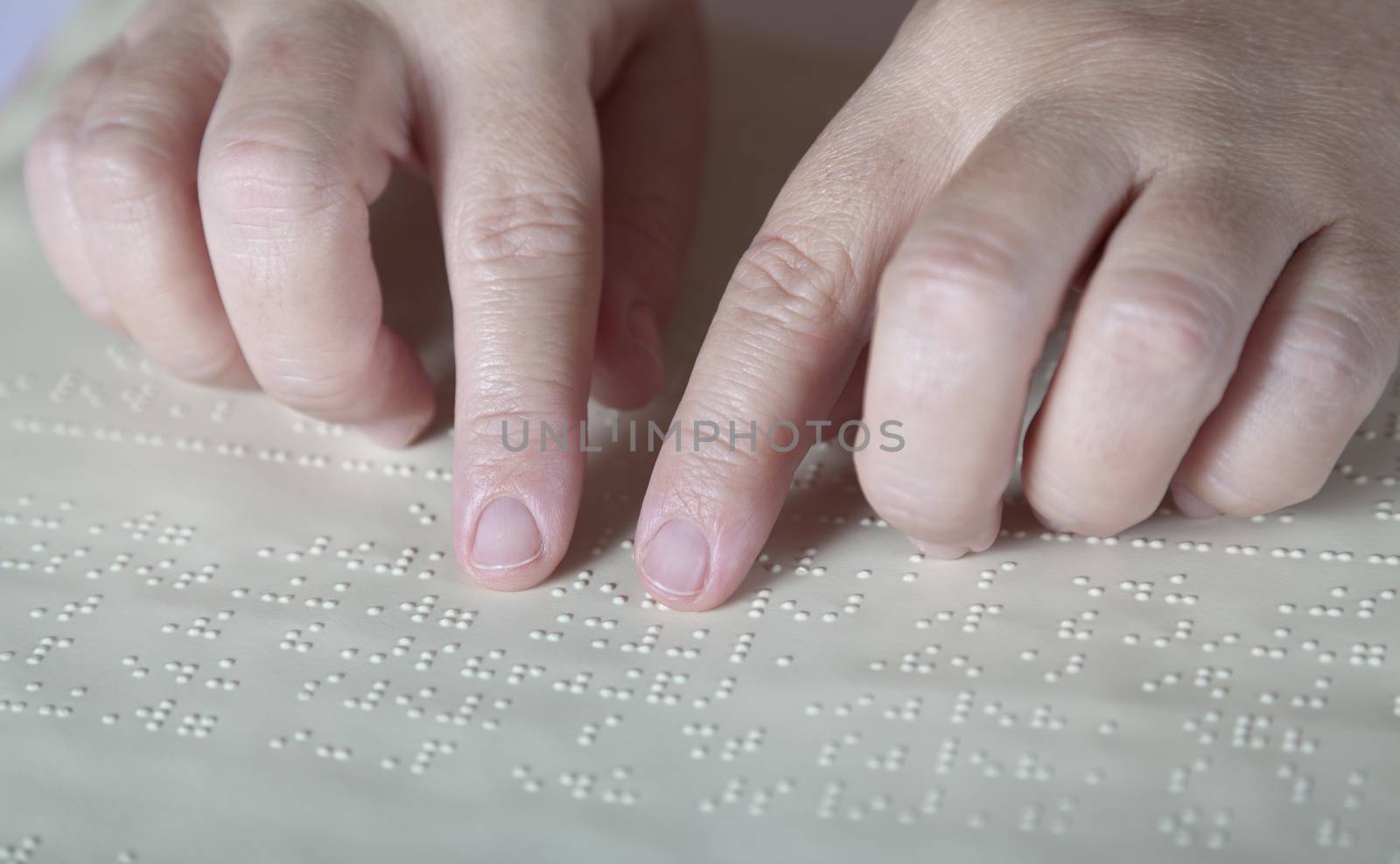 Blind reading text in braille language