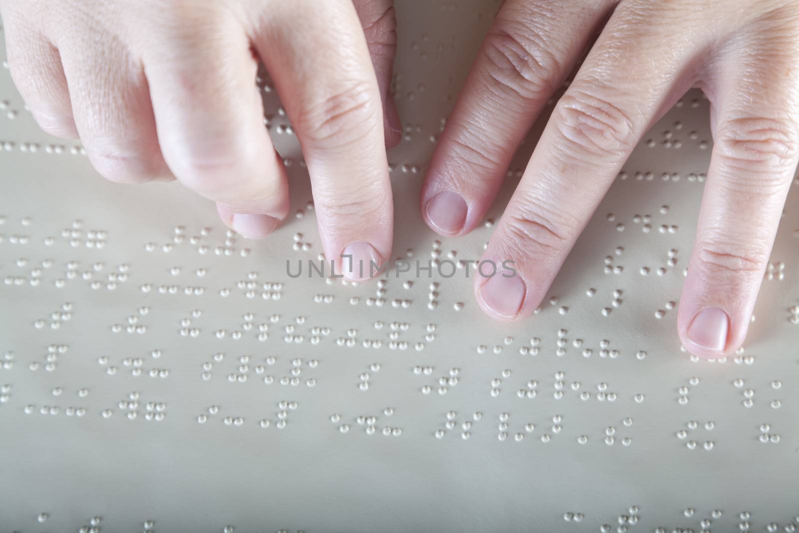 Blind reading text in braille language