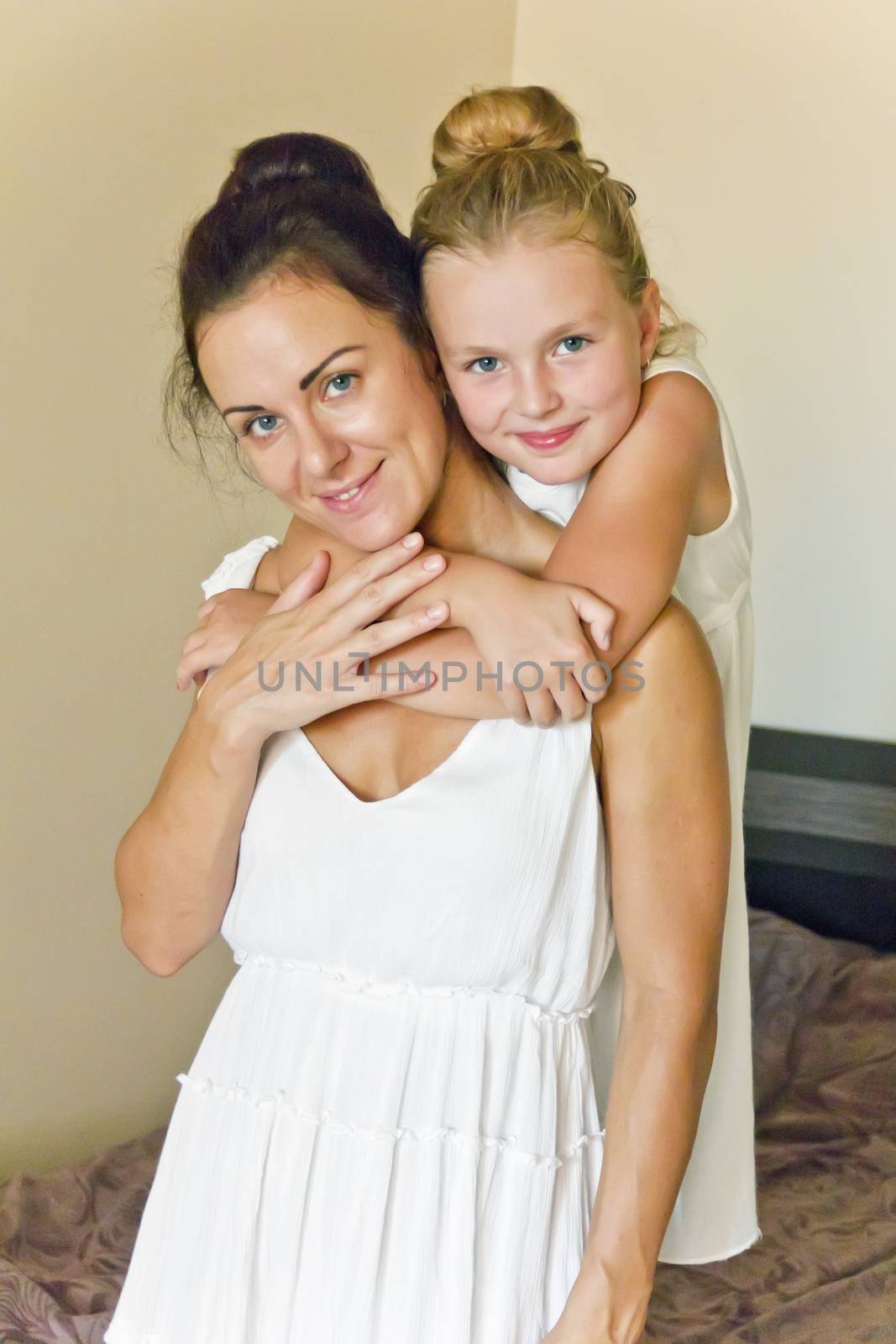 Photo of mother and daughter in white