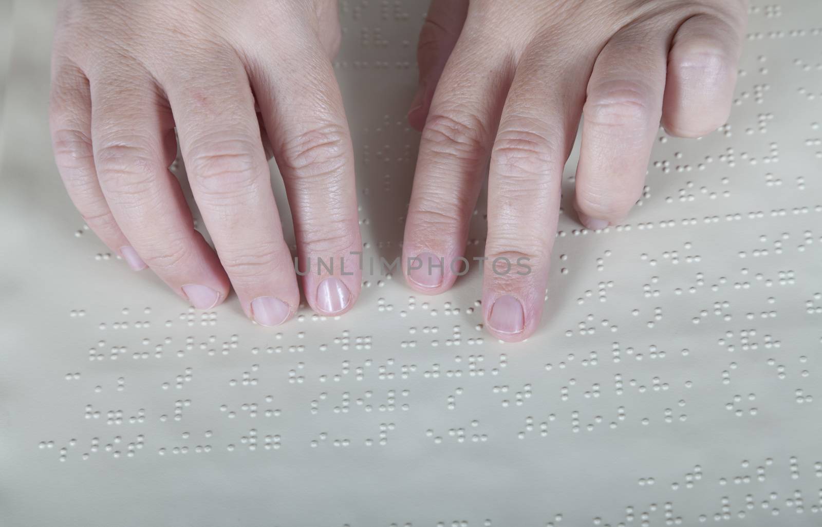 Blind reading text in braille language