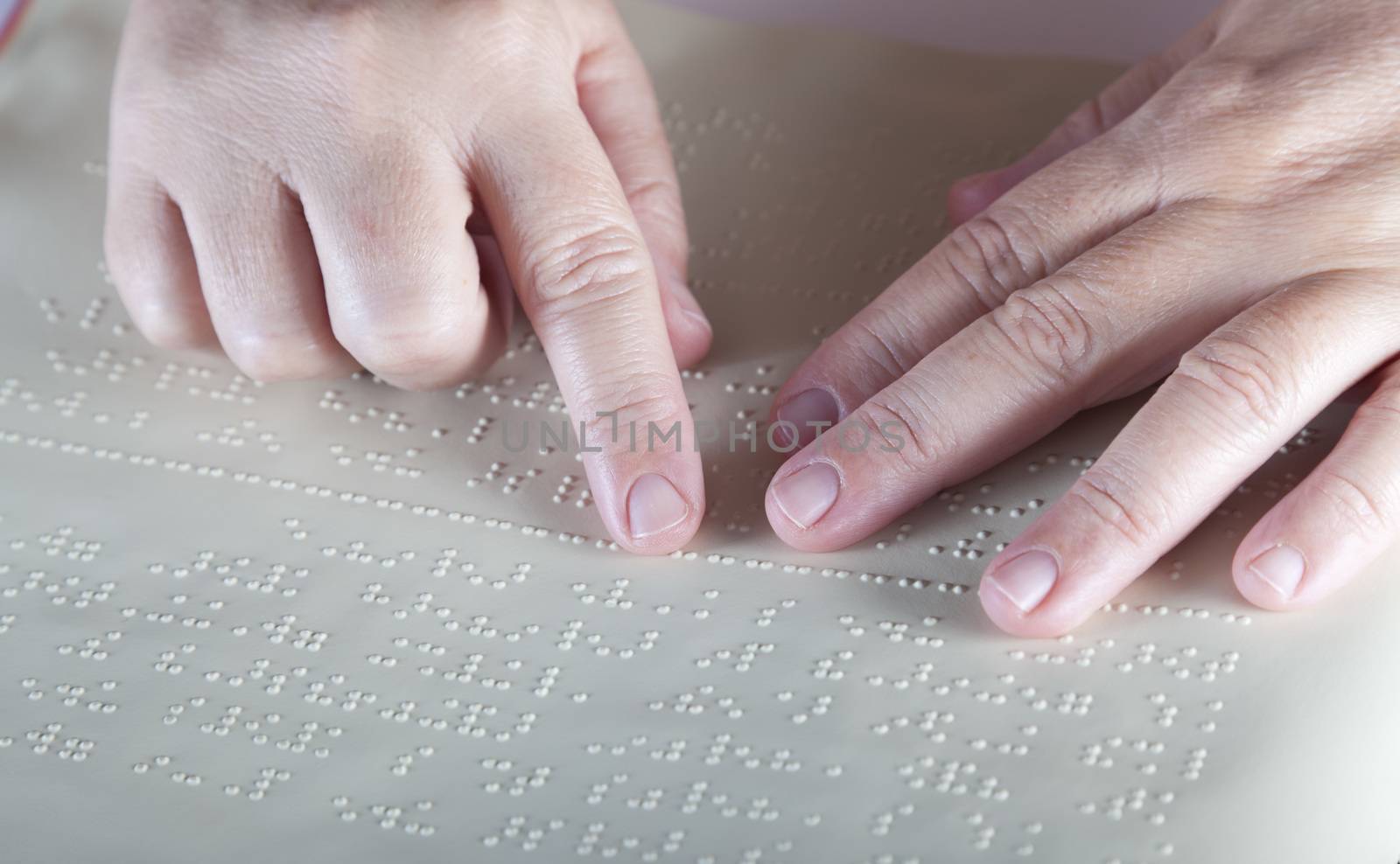 Blind reading text in braille language