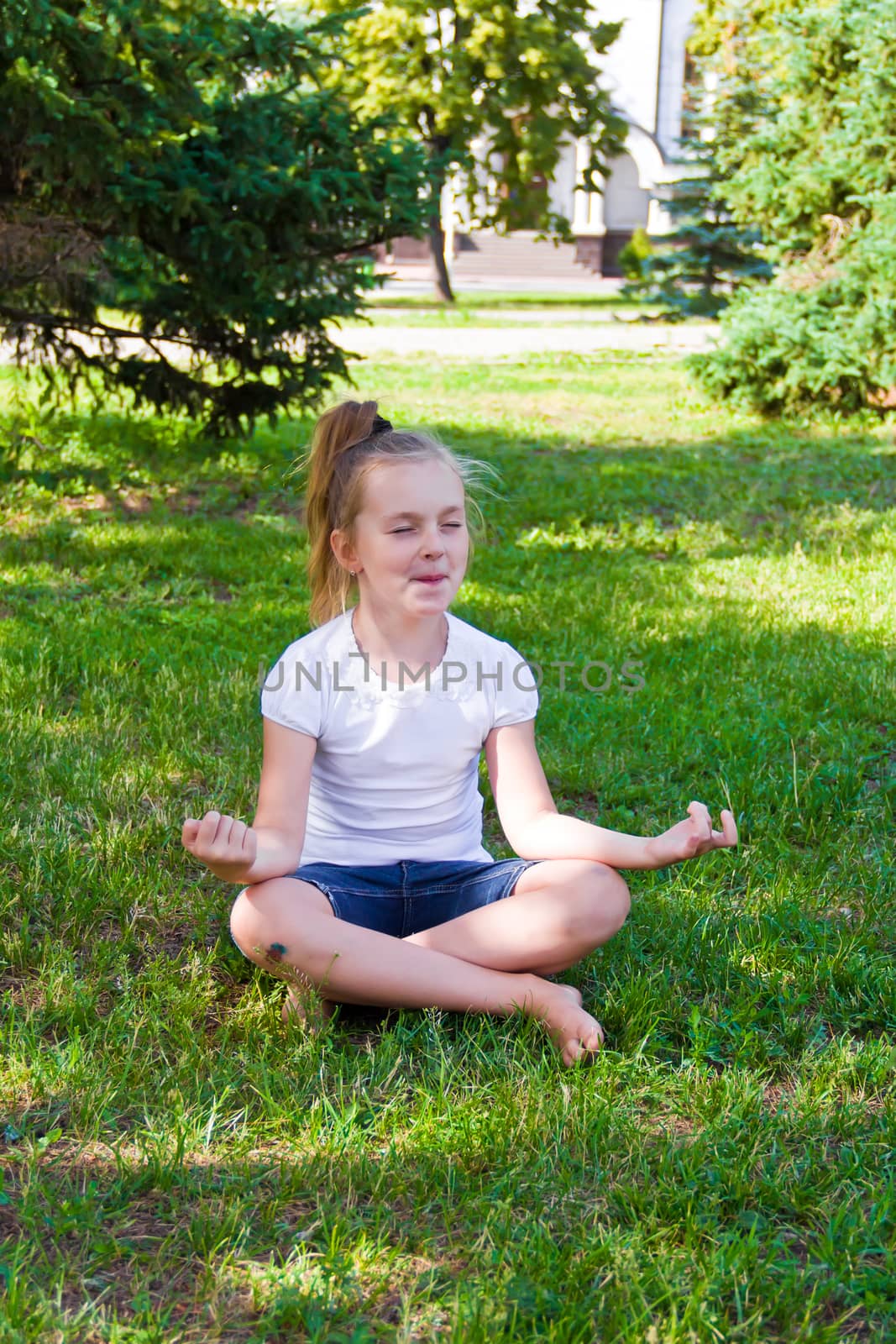 Cute girl in lotus pose with sore knee by Julialine