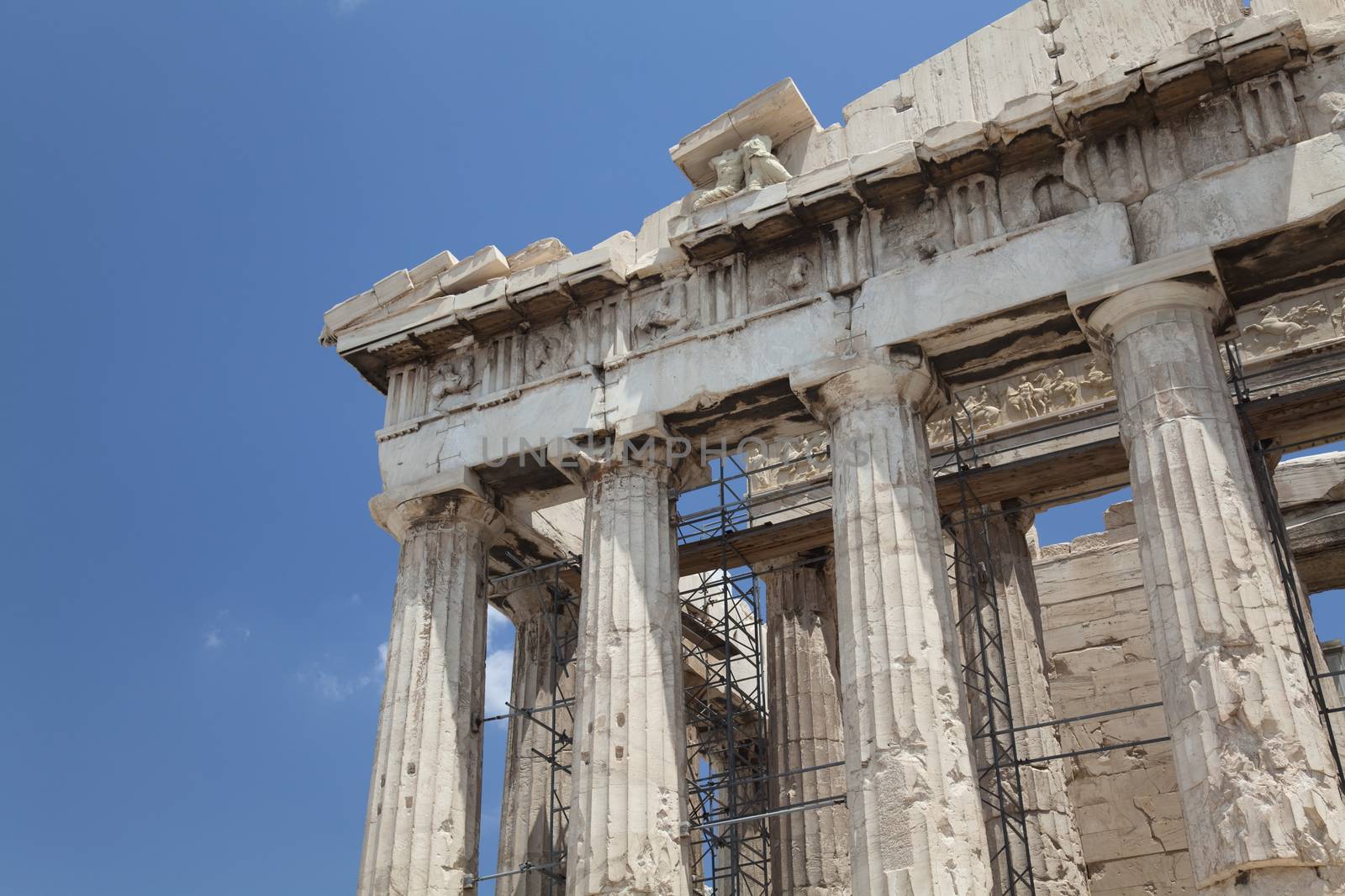 The Parthenon is a temple on the Athenian Acropolis, Greece, dedicated to the maiden goddess Athena, whom the people of Athens considered their patron deity. Its construction began in 447 BC when the Athenian Empire was at the height of its power. It was completed in 438 BC, although decoration of the building continued until 432 BC.