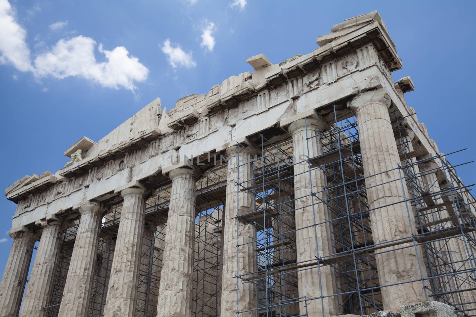 The Parthenon is a temple on the Athenian Acropolis, Greece, dedicated to the maiden goddess Athena, whom the people of Athens considered their patron deity. Its construction began in 447 BC when the Athenian Empire was at the height of its power. It was completed in 438 BC, although decoration of the building continued until 432 BC.