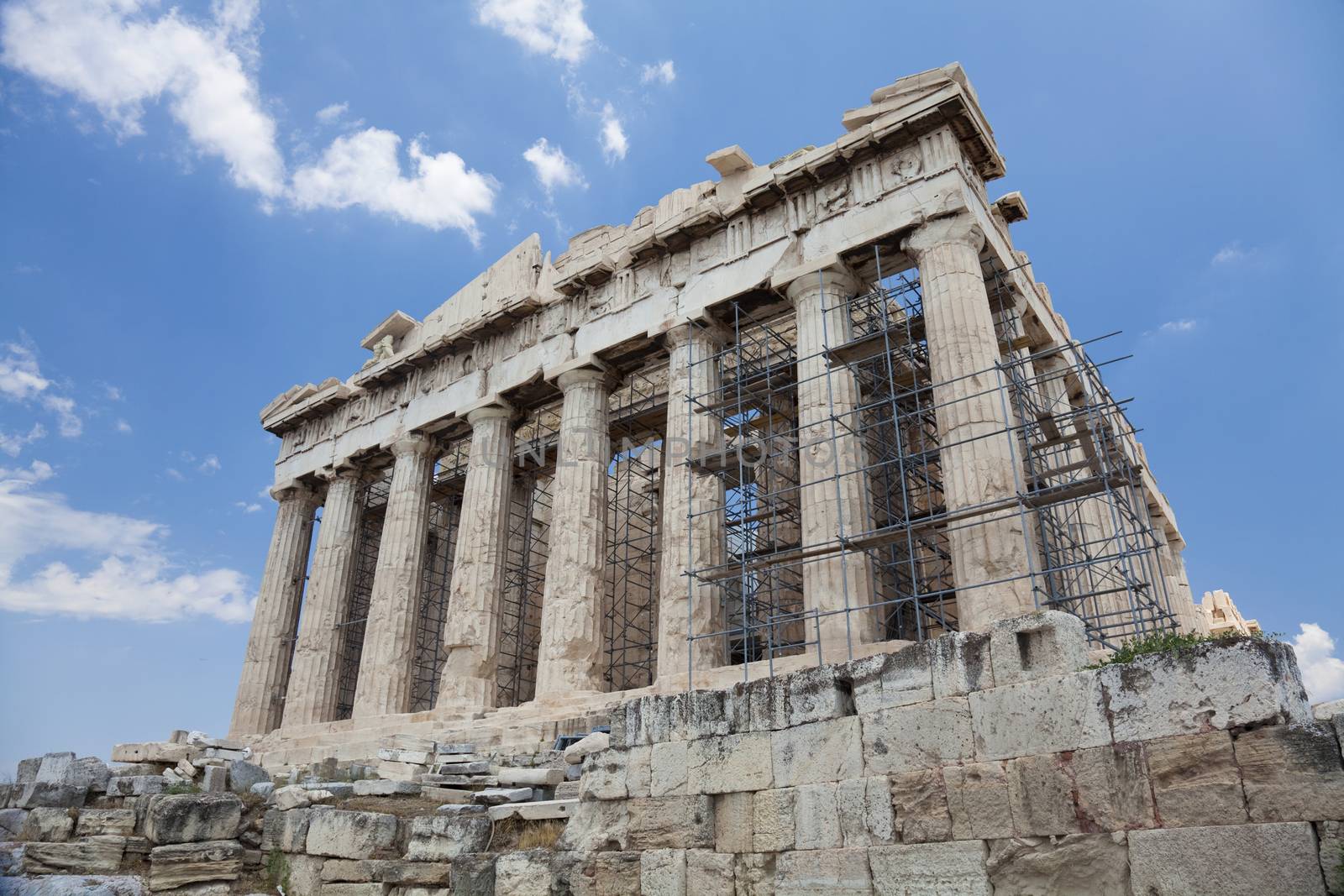 The Parthenon is a temple on the Athenian Acropolis, Greece, dedicated to the maiden goddess Athena, whom the people of Athens considered their patron deity. Its construction began in 447 BC when the Athenian Empire was at the height of its power. It was completed in 438 BC, although decoration of the building continued until 432 BC.