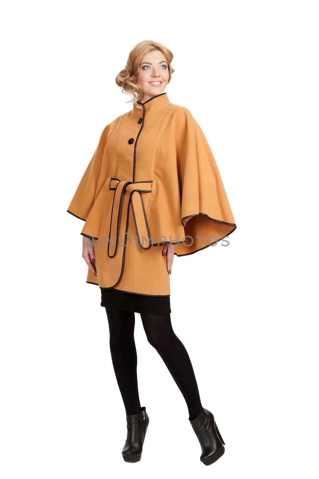 The girl in a yellow autumn coat on a white background