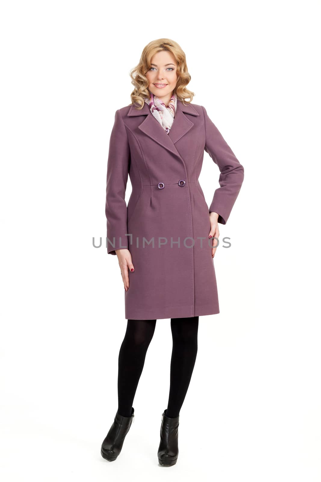 The girl in a violet  autumn coat on a white background