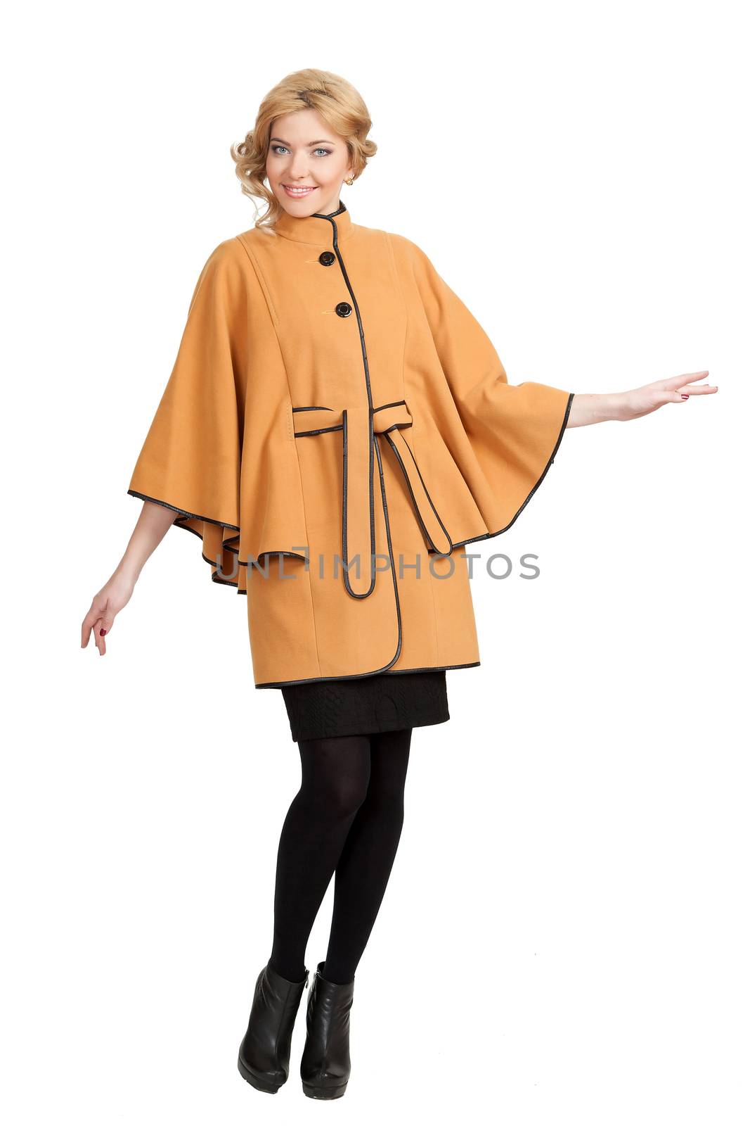 The girl in a yellow autumn coat on a white background