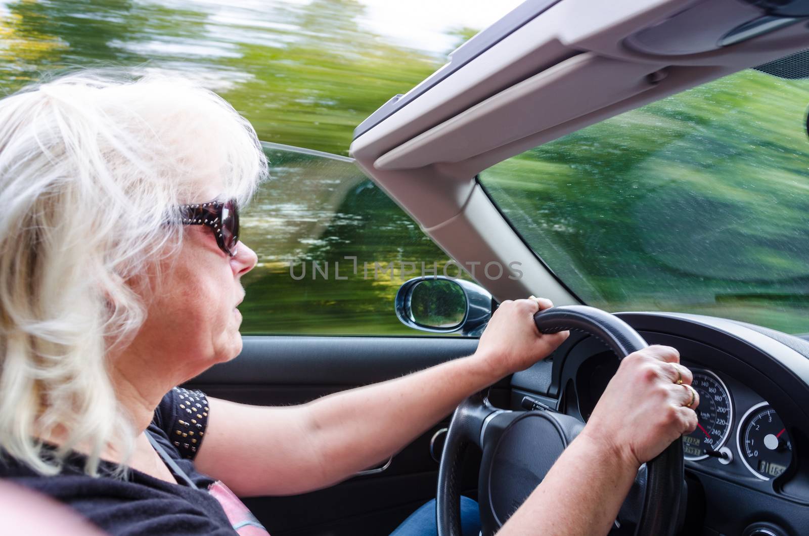 Beautiful Woman Driving Convertible Car with 261 mph