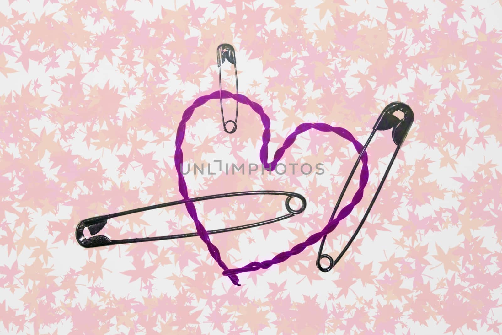 broken heart fixed with safety pins by yands