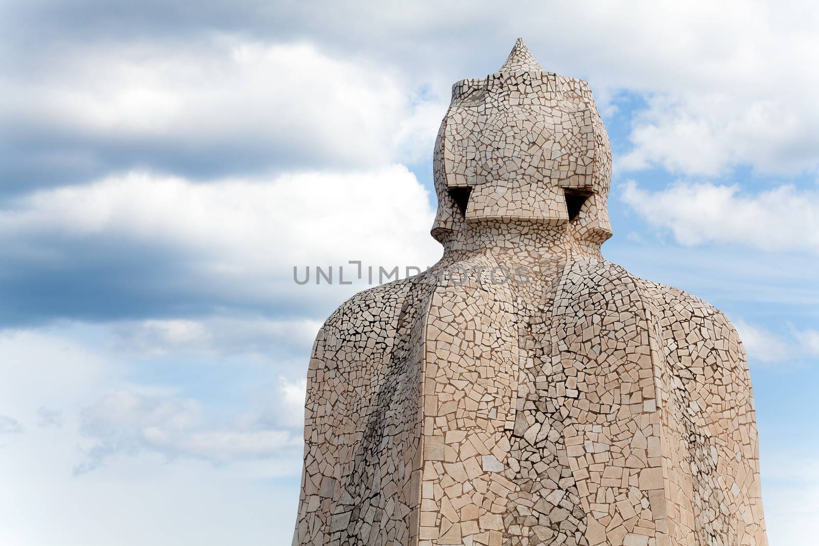 BARCELONA - APR 14: Chimneys covered with ceramic fragments that look like helmets at La Pedrera (Casa Mila) on Apr 14, 2012 in Barcelona, Spain. Casa Mila was built in 1910 by Antoni Gaudi.