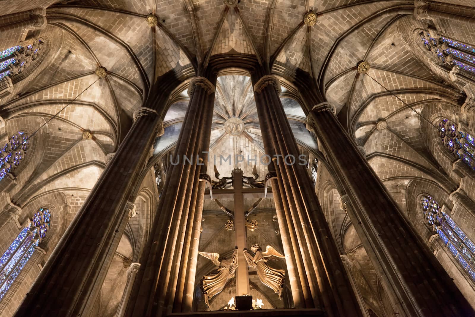 The Cathedral of the Holy Cross and Saint Eulalia also known as Barcelona Cathedral, is the Gothic cathedral and seat of the Archbishop of Barcelona, Spain. The cathedral was constructed throughout the 13th to 15th centuries, with the principal work done in the 14th century. The cloister, which encloses the Well of the Geese was completed about 1450. The neo-Gothic facade was constructed over the nondescript exterior that was common to Catalan churches in the 19th century. The roof is notable for its gargoyles, featuring a wide range of animals, both domestic and mythical.