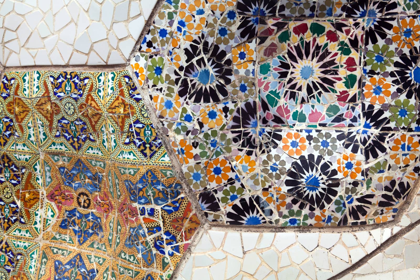 Old ceramic tiles in Park Guell - Barcelona, Spain by Portokalis