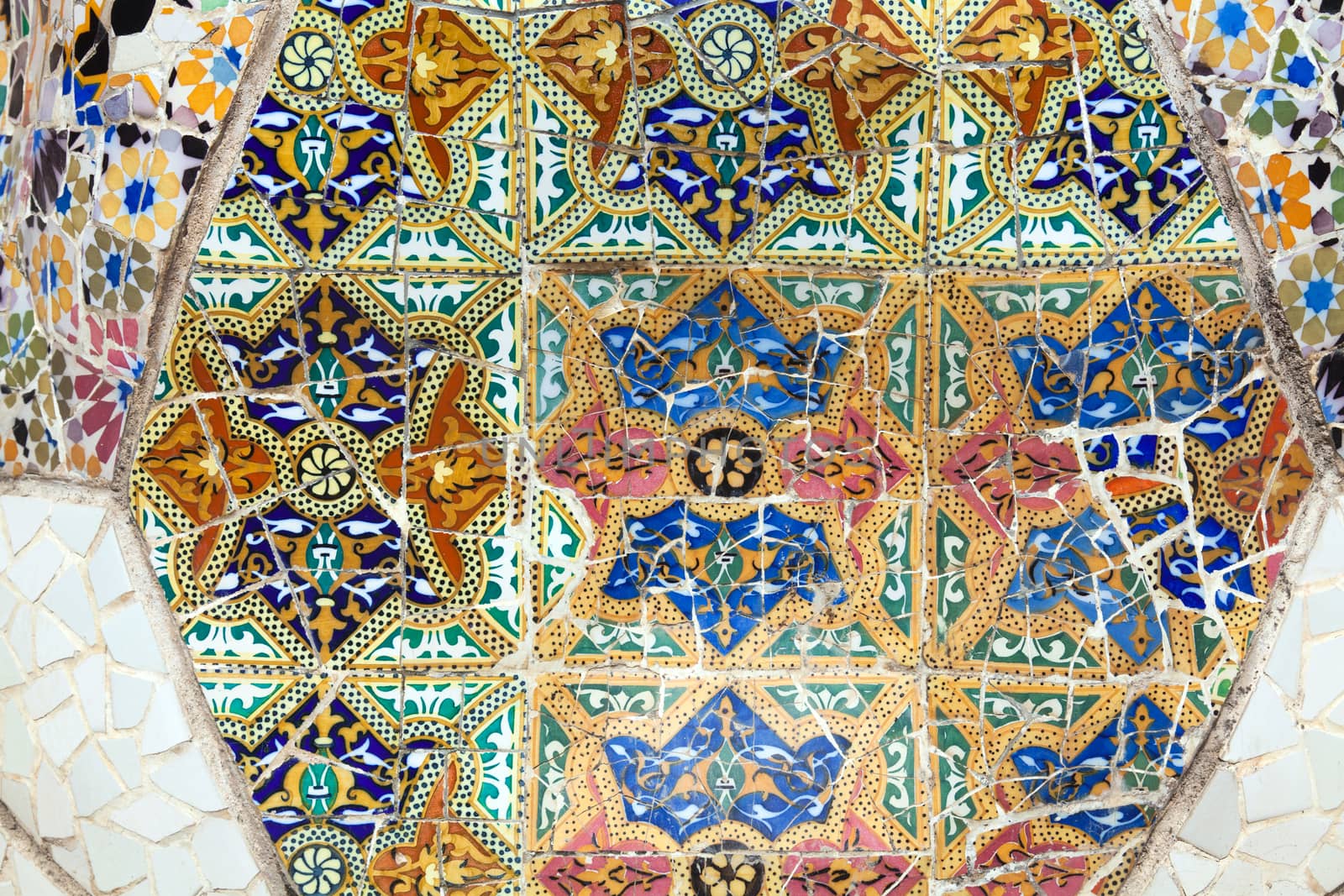 Old ceramic tiles in Park Guell - Barcelona, Spain by Portokalis