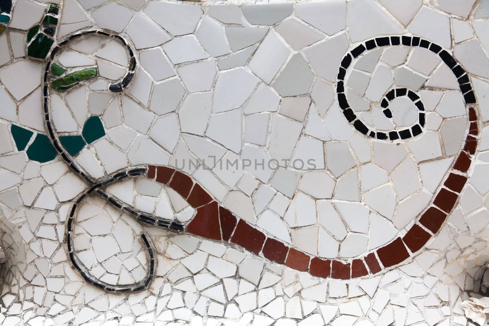 Old ceramic tiles in Park Guell - Barcelona, Spain by Portokalis