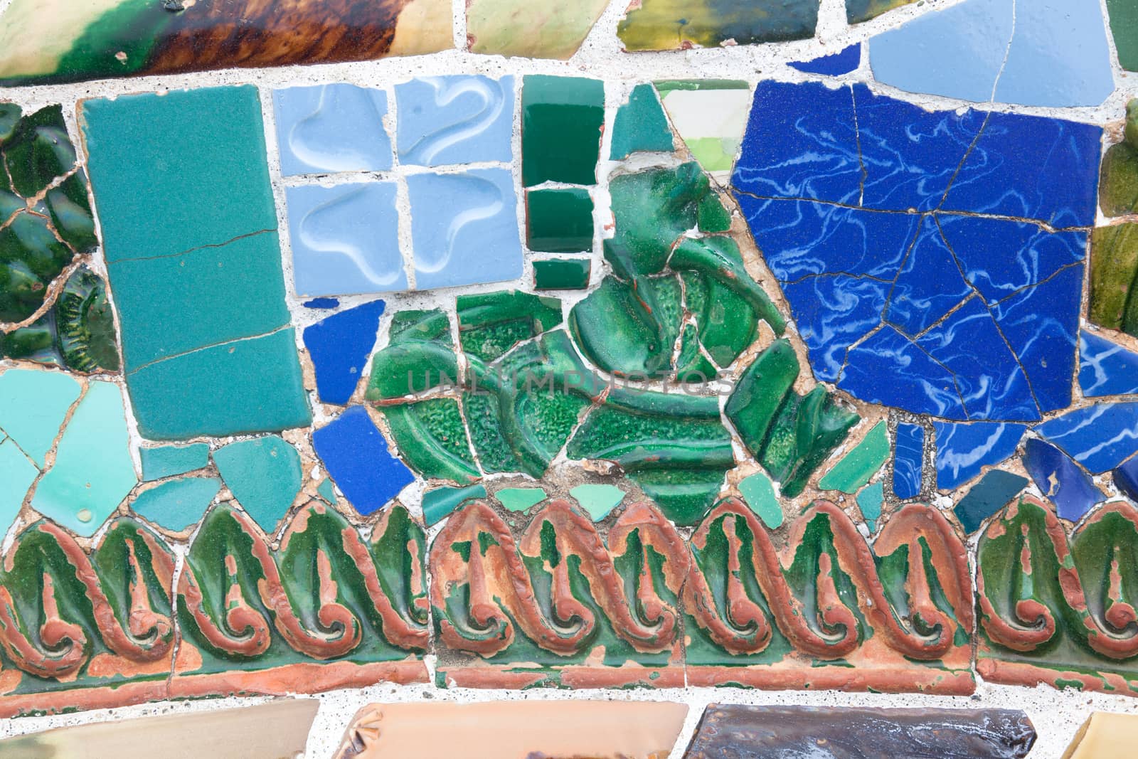 Old ceramic tiles in Park Guell - Barcelona, Spain by Portokalis