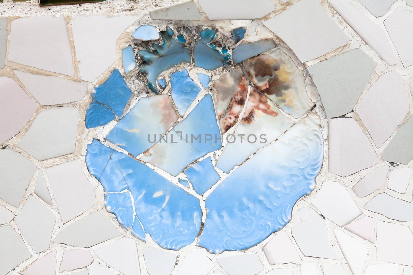 Old ceramic tiles in Park Guell - Barcelona, Spain by Portokalis