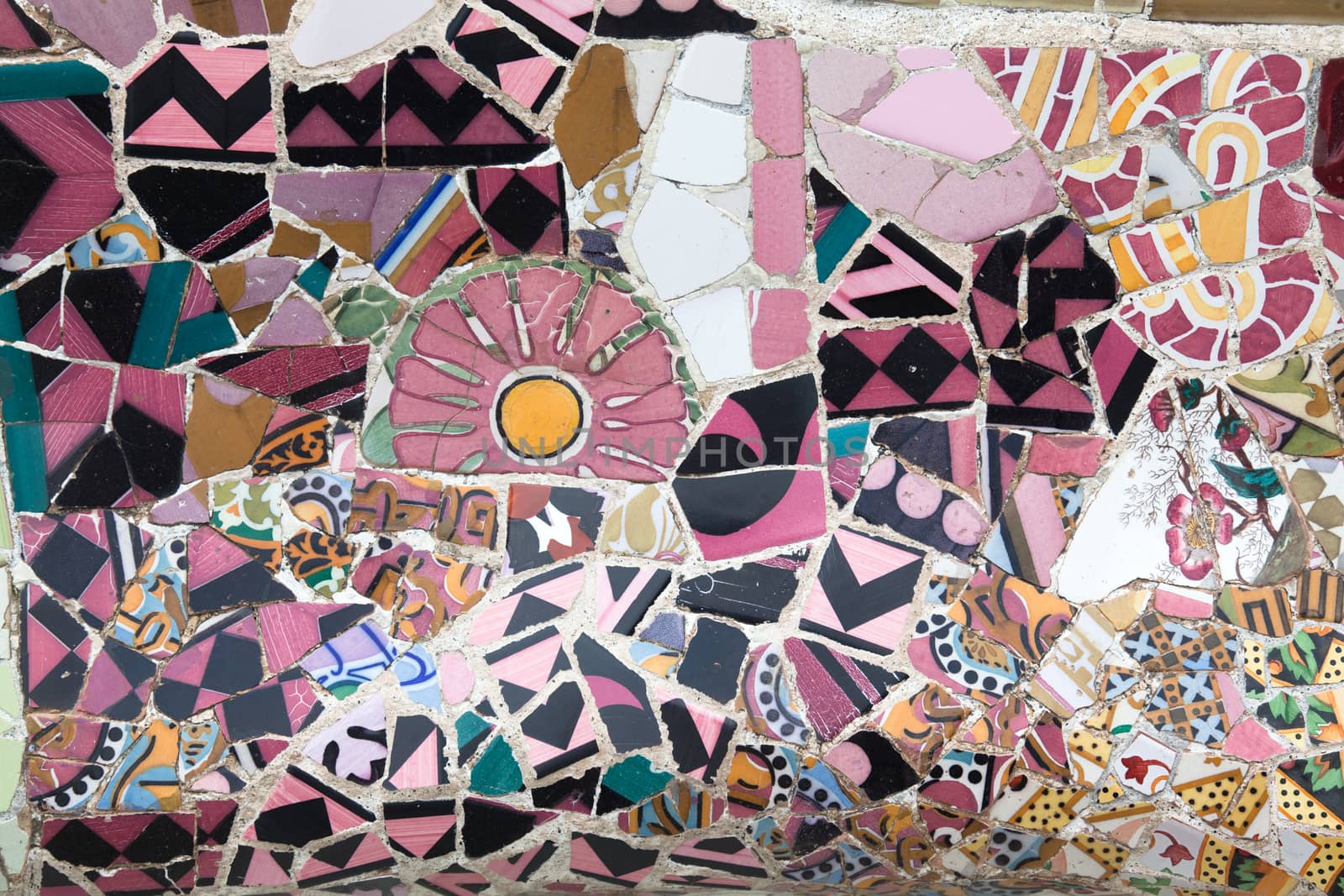 Old ceramic tiles in Park Guell - Barcelona, Spain by Portokalis