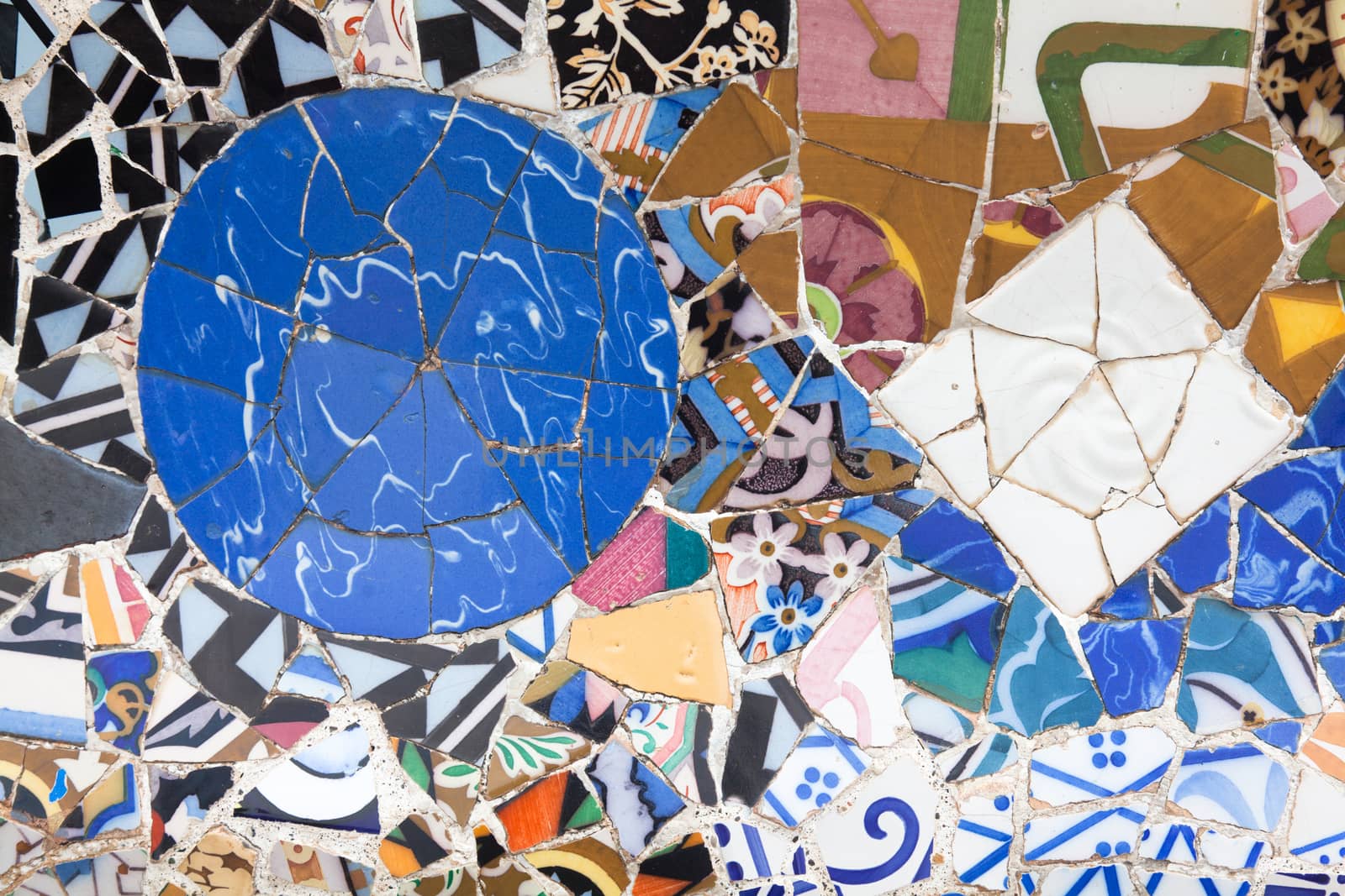 Old ceramic tiles in Park Guell - Barcelona, Spain by Portokalis