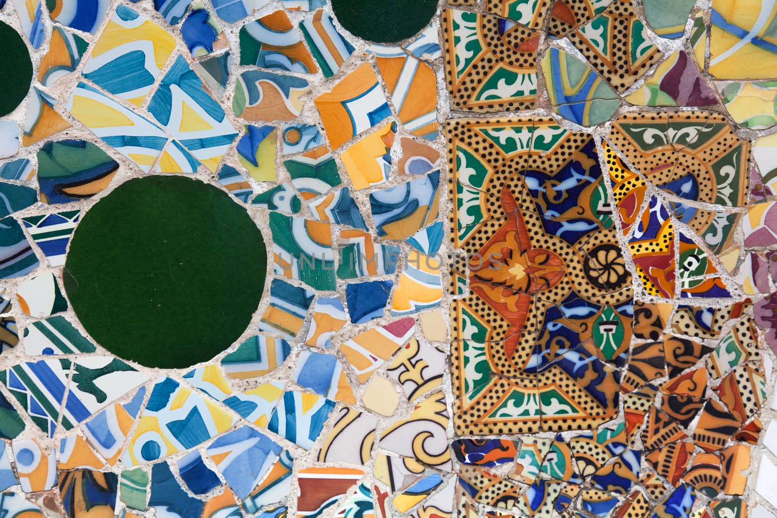 Old ceramic tiles in Park Guell - Barcelona, Spain by Portokalis