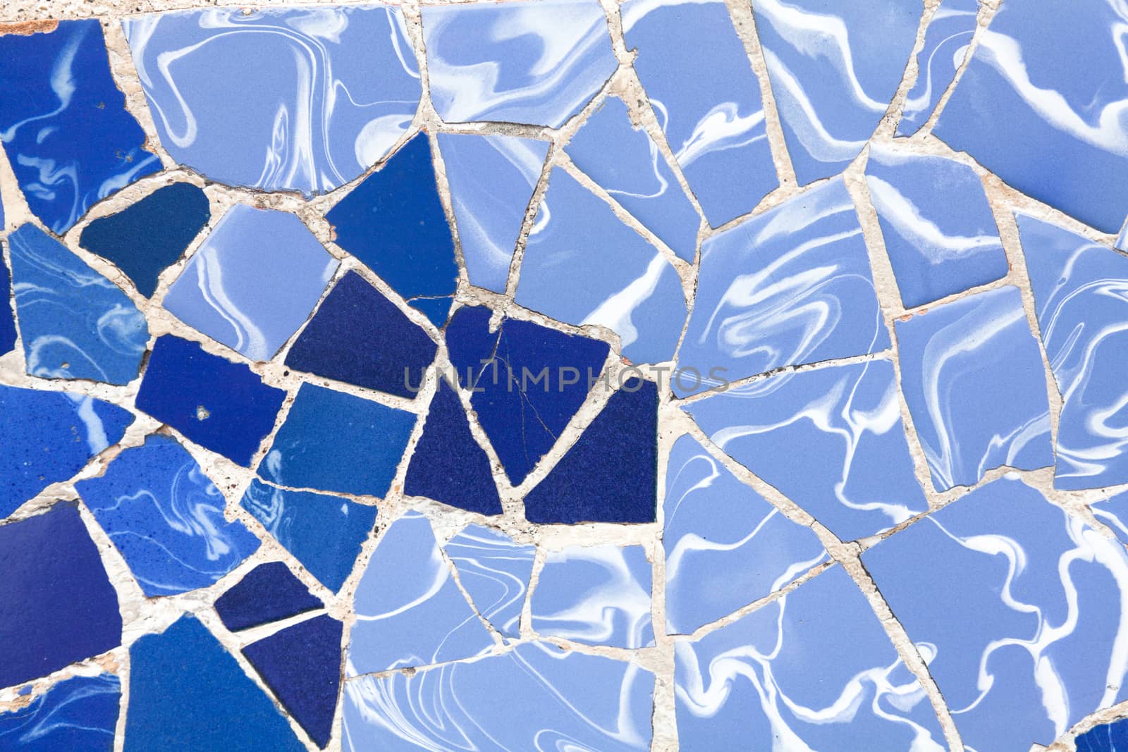 Old ceramic tiles in Park Guell - Barcelona, Spain by Portokalis