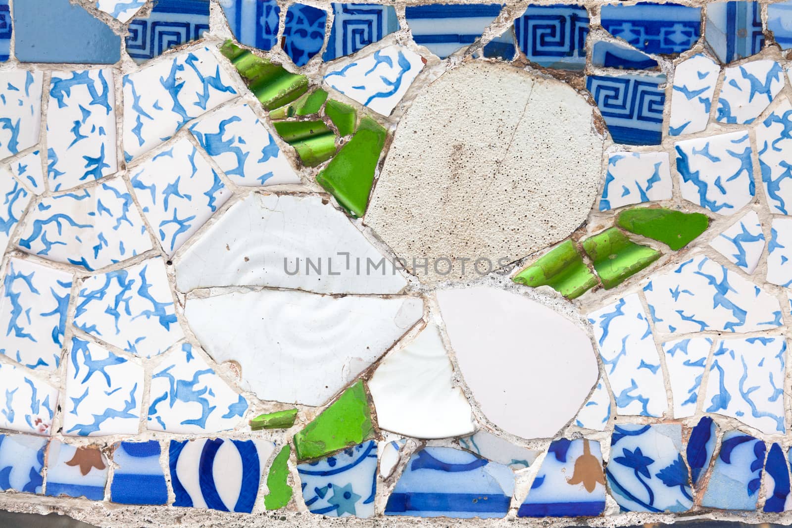 Old ceramic tiles in Park Guell - Barcelona, Spain by Portokalis