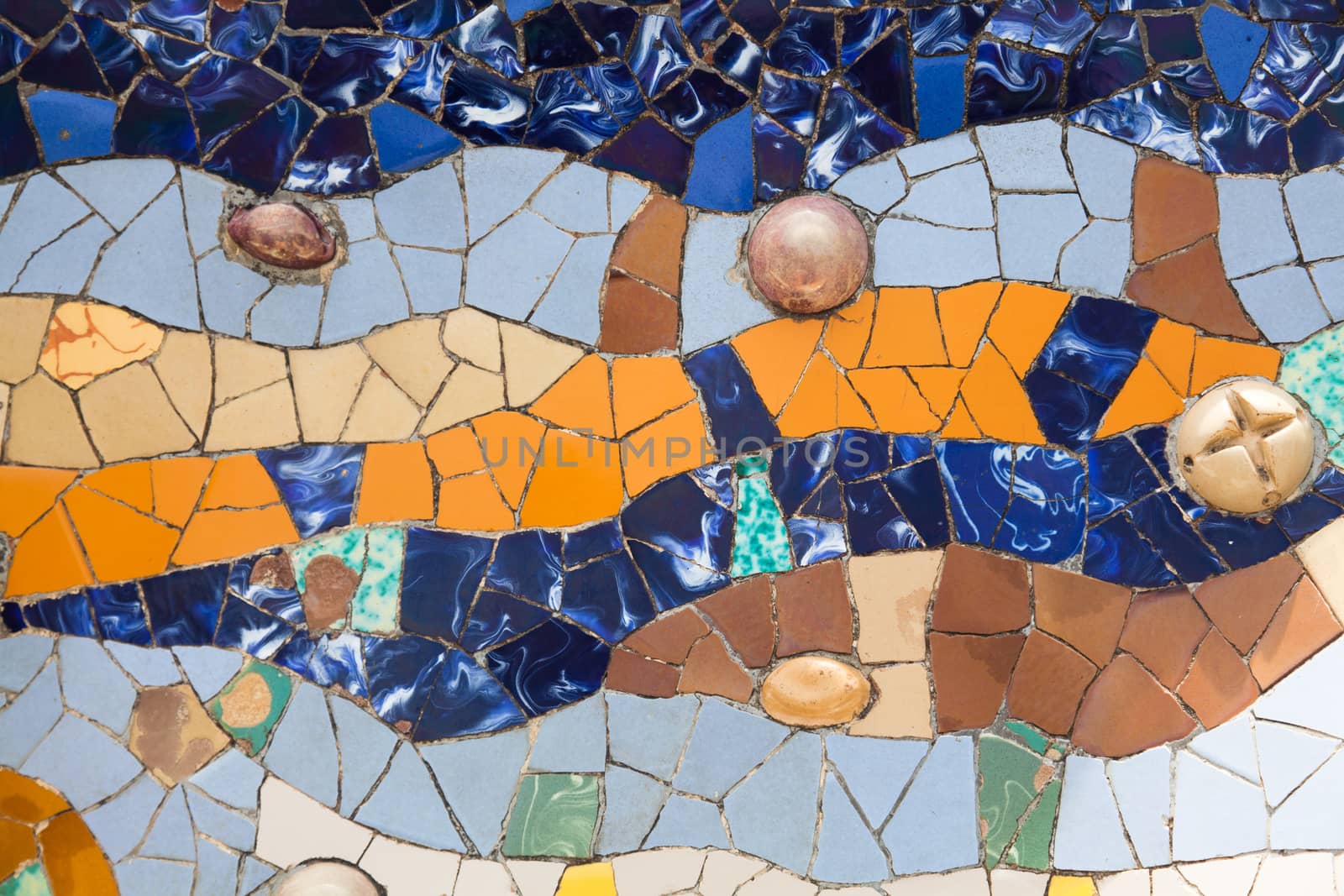 Old ceramic tiles in Park Guell - Barcelona, Spain by Portokalis