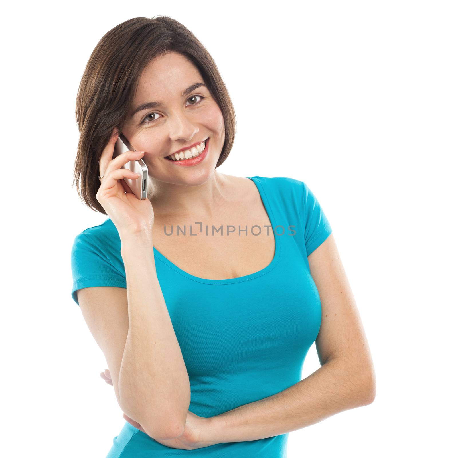Beautiful brunette talking on the phone, isolated on white