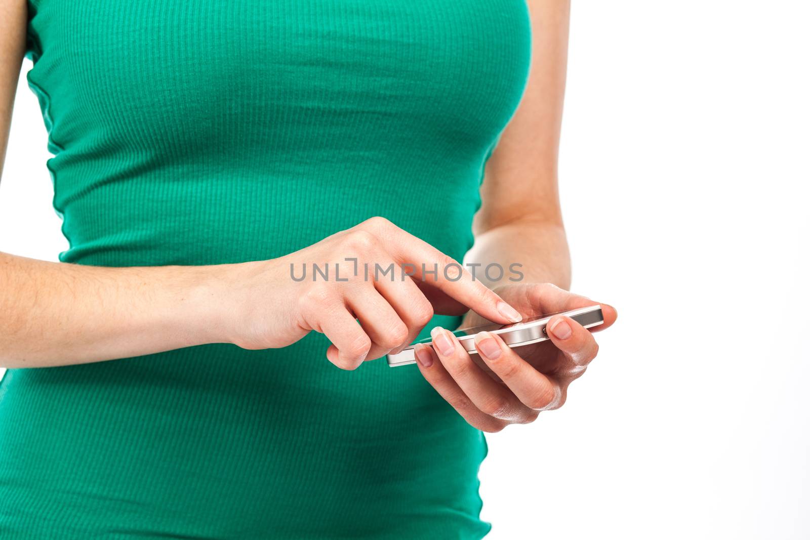 Close-up view of the hands of a woman writing a message on her phone, isolated on white