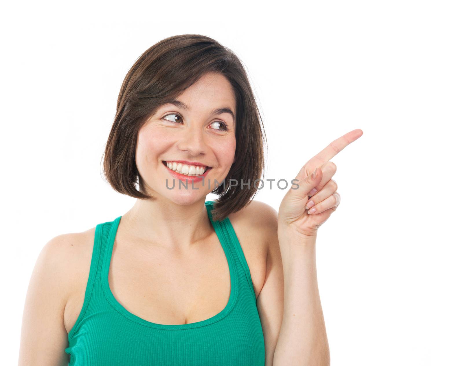 Smiling woman showing something with her finger, isolated on white 