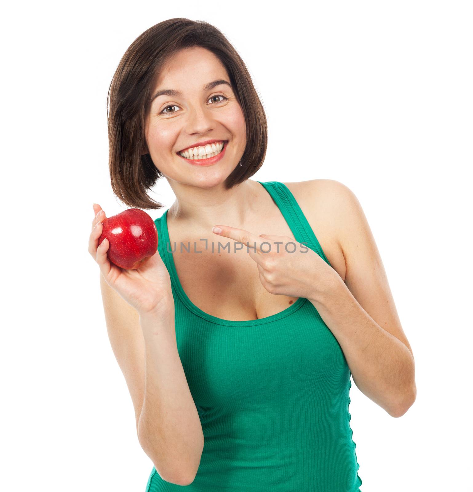 Beautiful young woman holding and showing a red apple, isolated on white