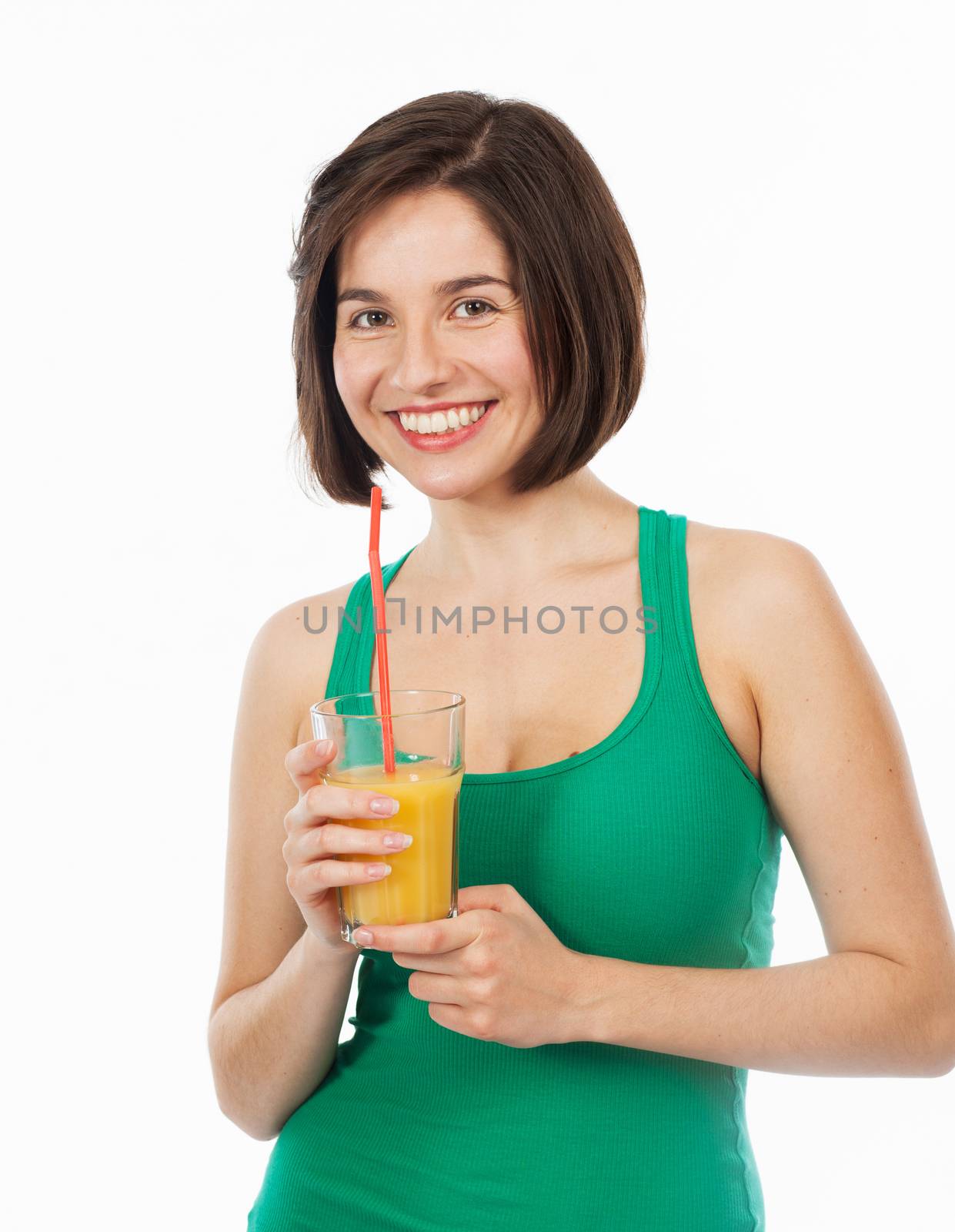 Portrait of a young woman drinking an orange juice with a straw, isolated on white