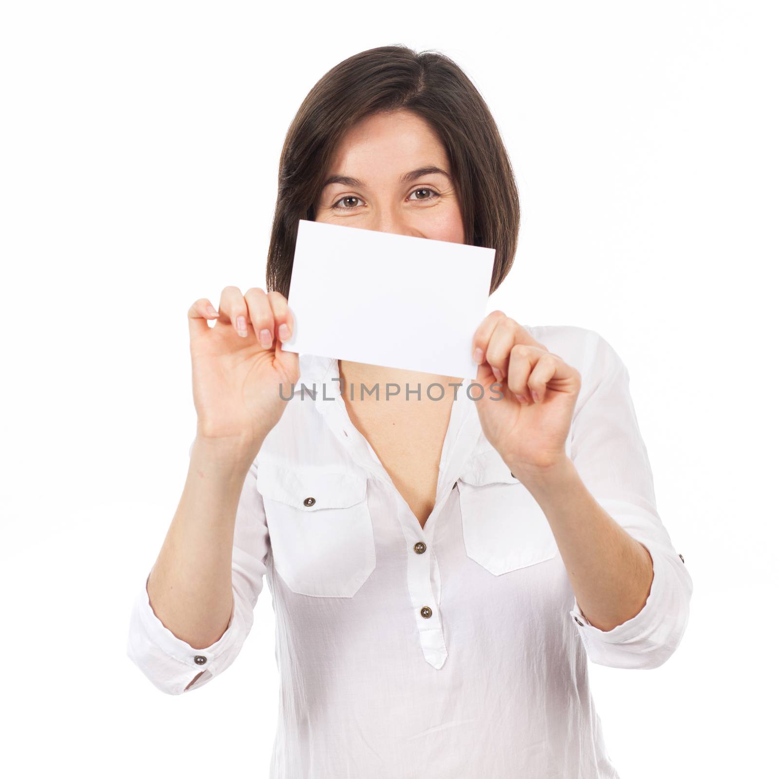 Pretty brunette presenting a white signboard, isolated on white