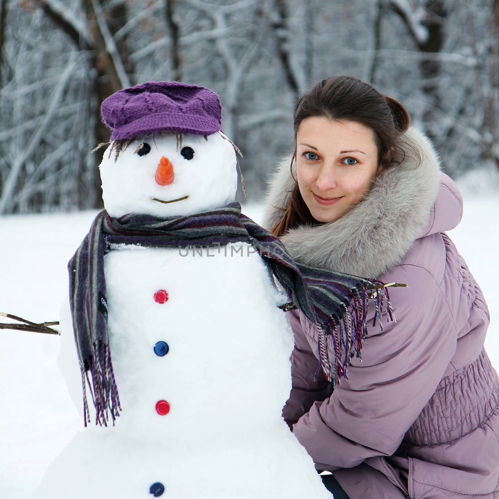 Beautiful brunette near a snowman by kav777