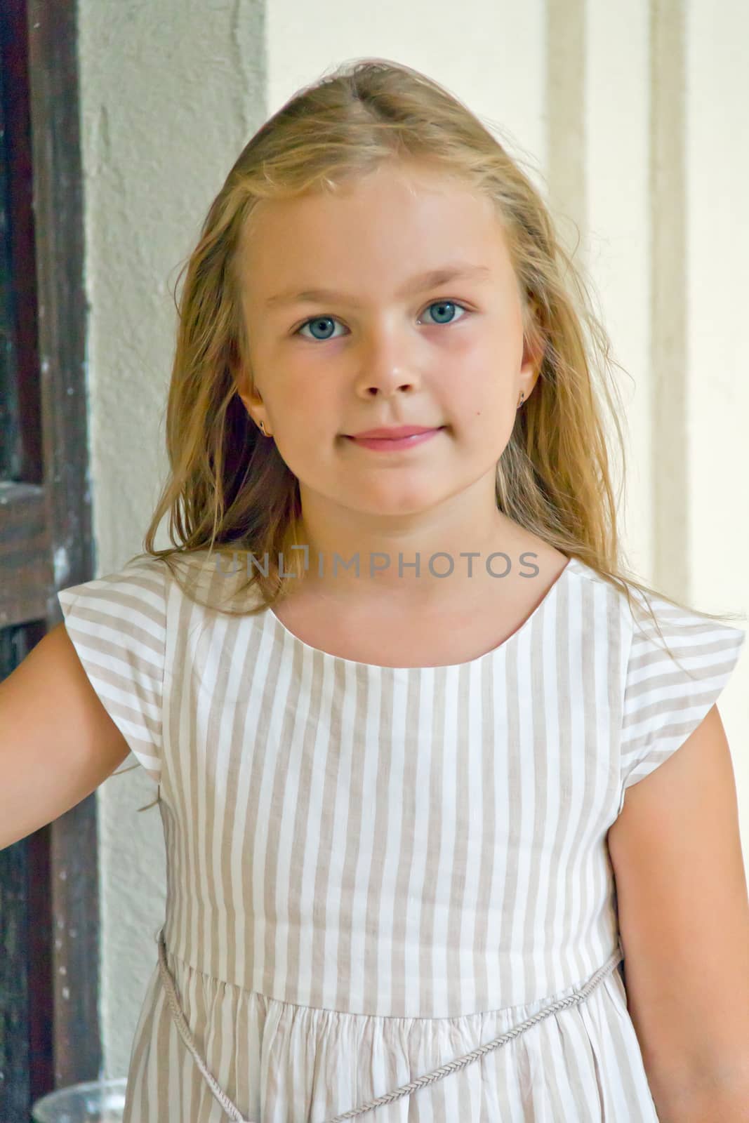 Photo of cute girl with big blue eyes