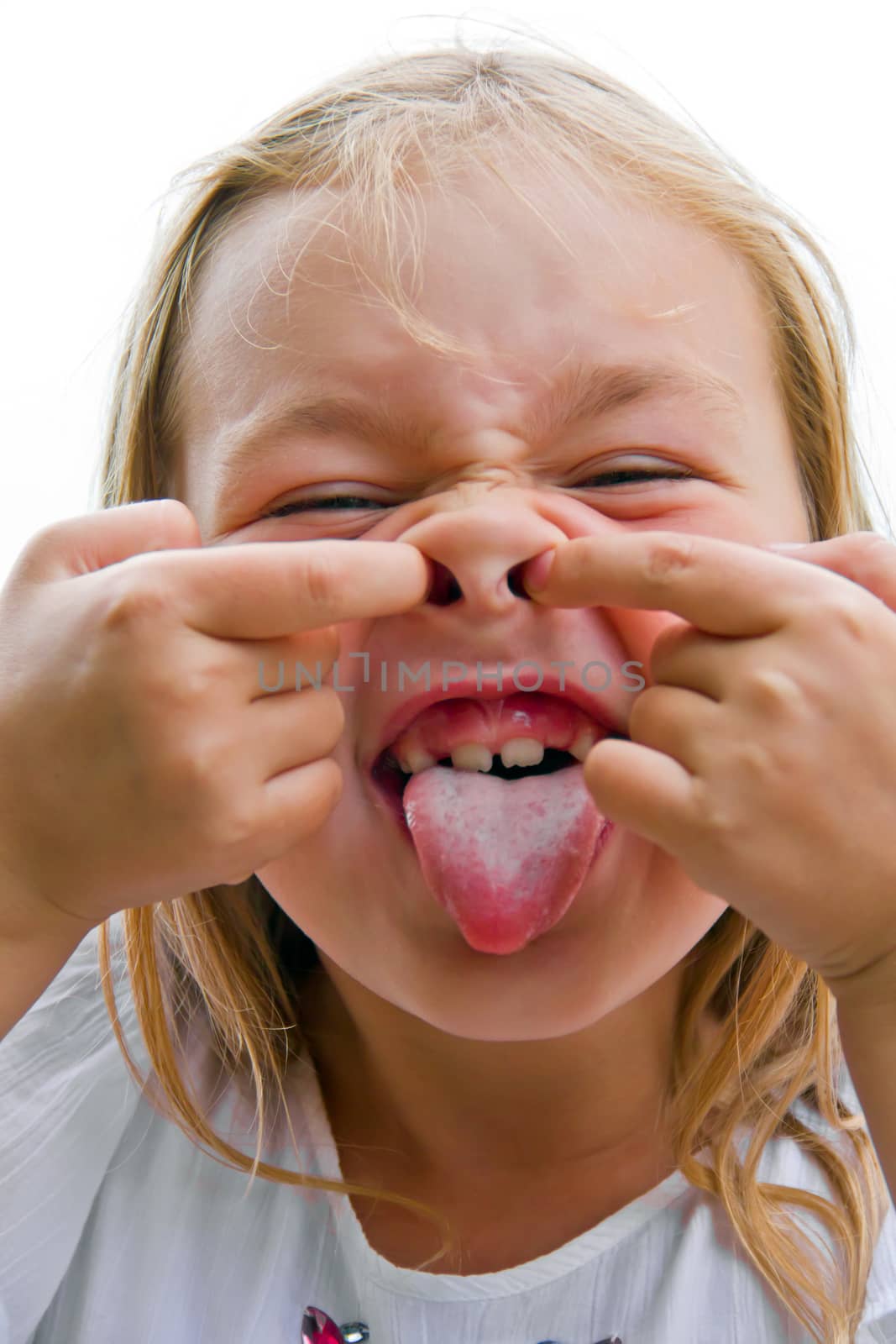 Cute beautiful girl makes faces imitate witch