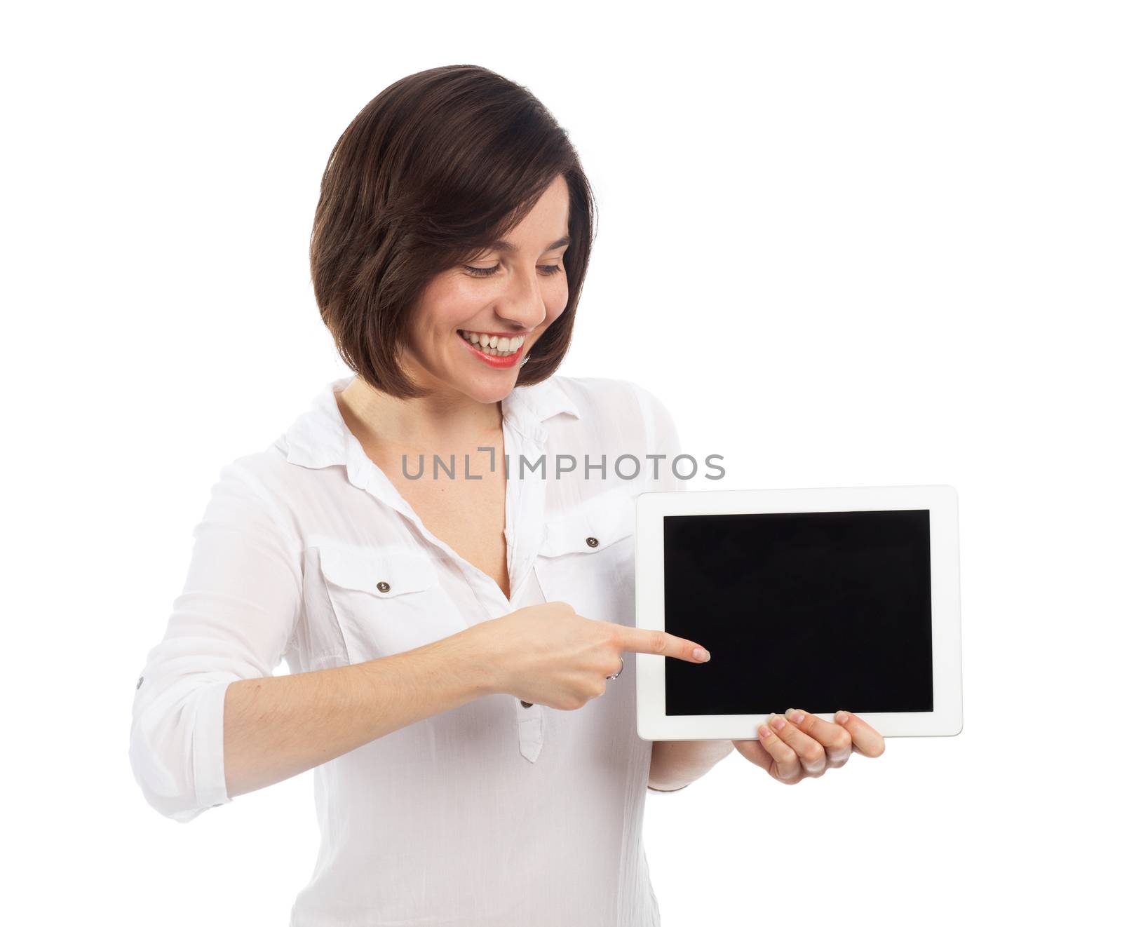 Cute brunette presenting a blank touchpad with her finger, communication concept, isolated on white