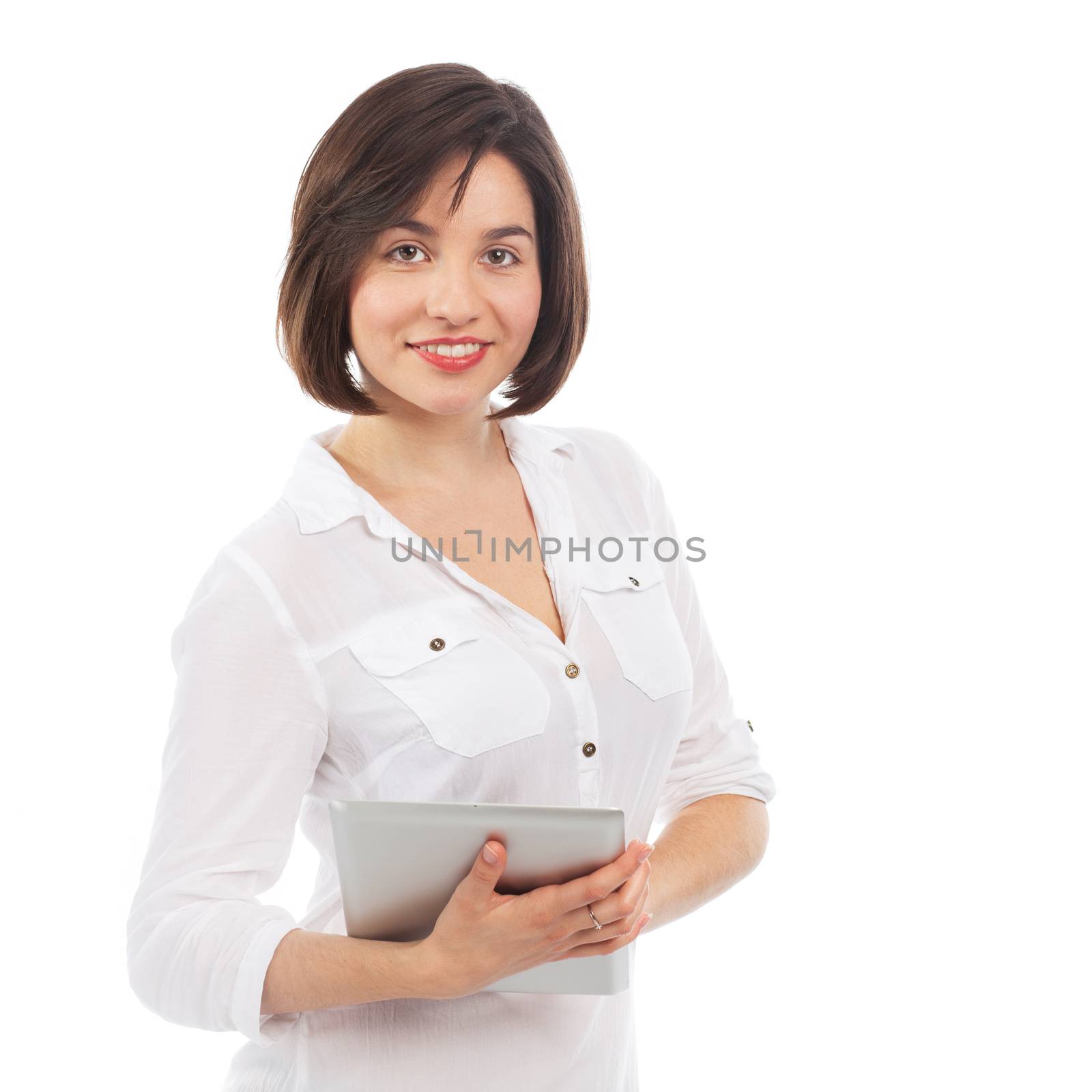 Young smiling brunette surfing on a touchpad, isolated on white