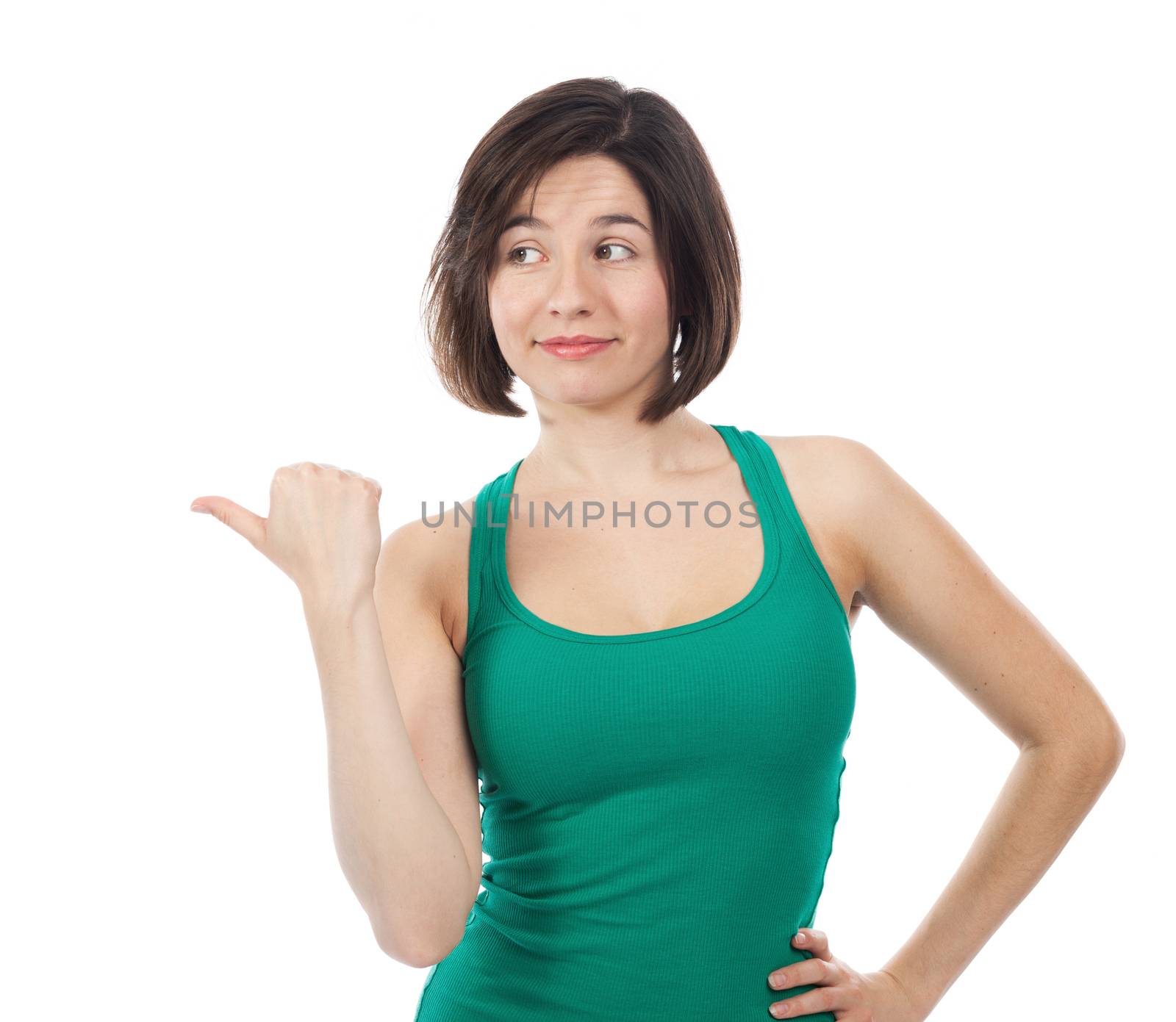 Pretty brunette pointing up with her thumb, isolated on white 