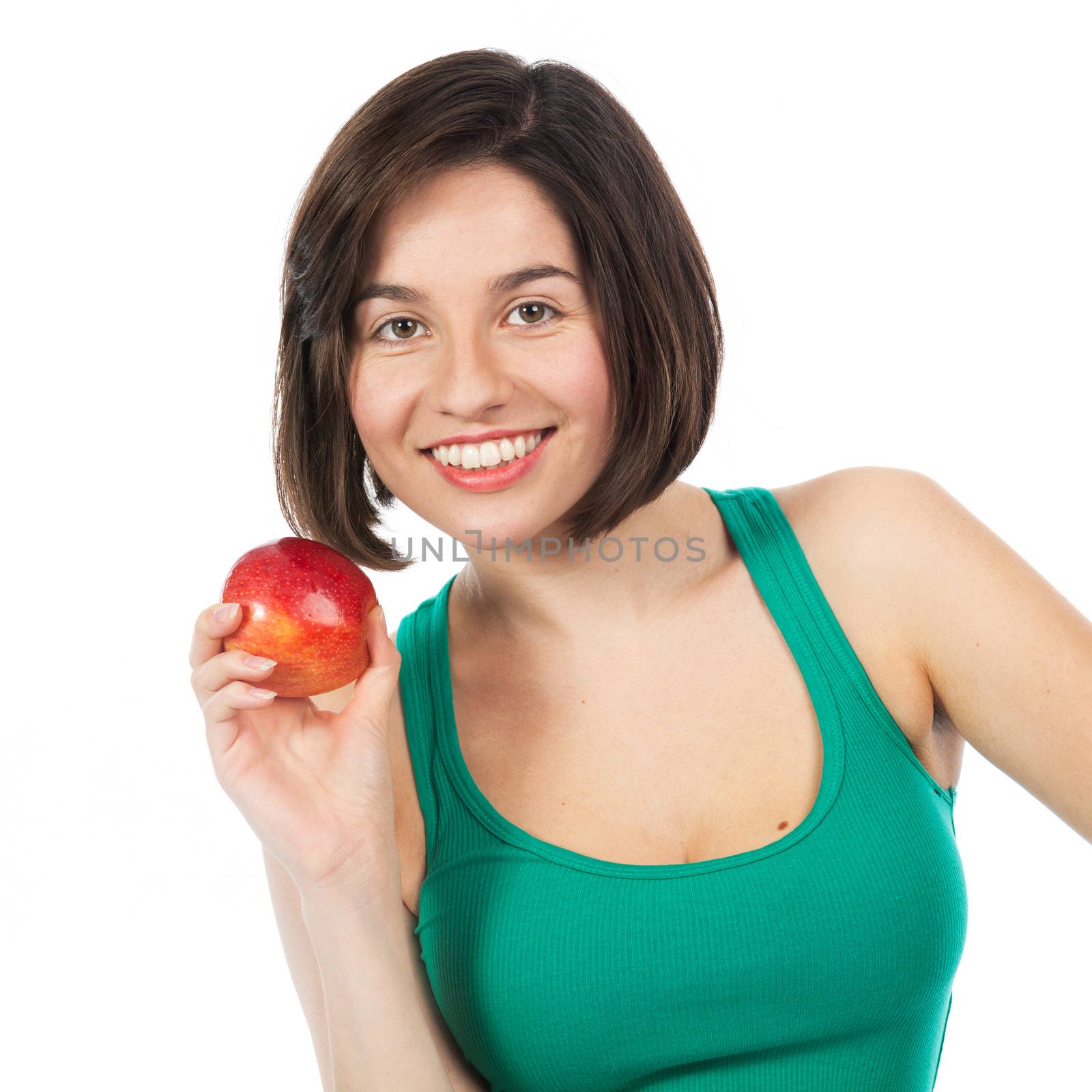 Beautiful young brunette holding a red apple, isolated on white