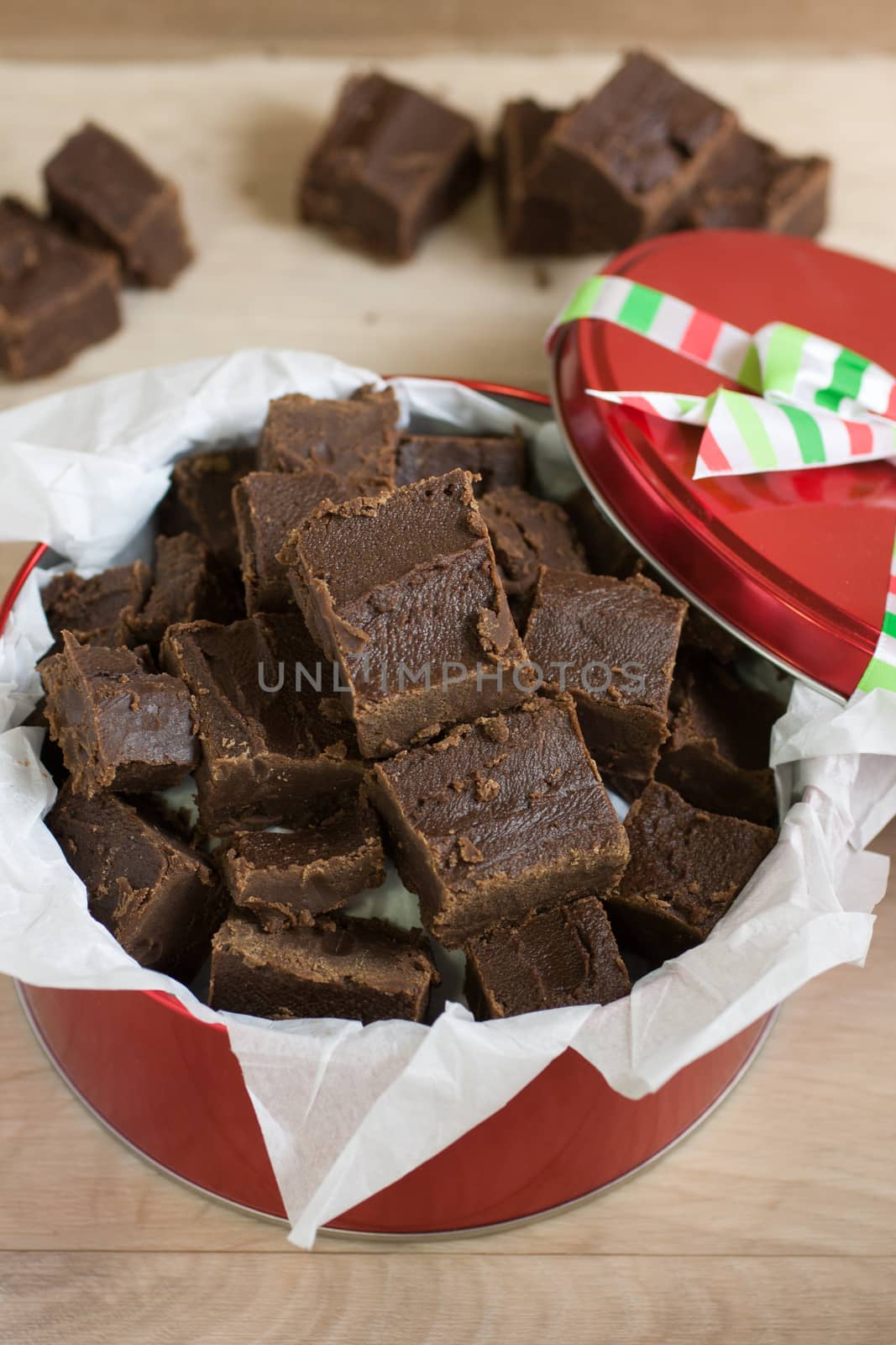 Handmade fudge packed in a holiday gift tin.